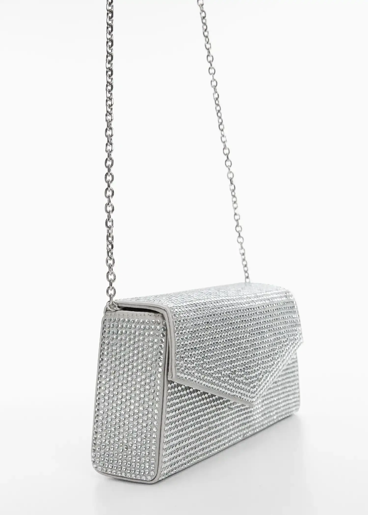 Mango Chain bag with crystals. a close up of a purse on a white surface 