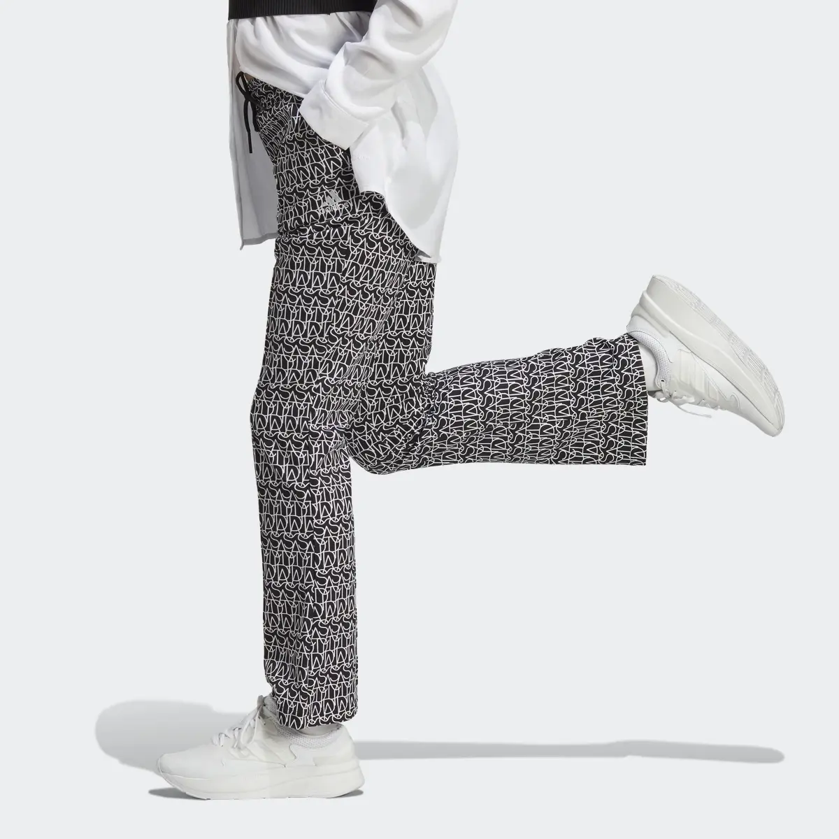 Adidas Allover adidas Graphic High-Rise Flare Pants. 2