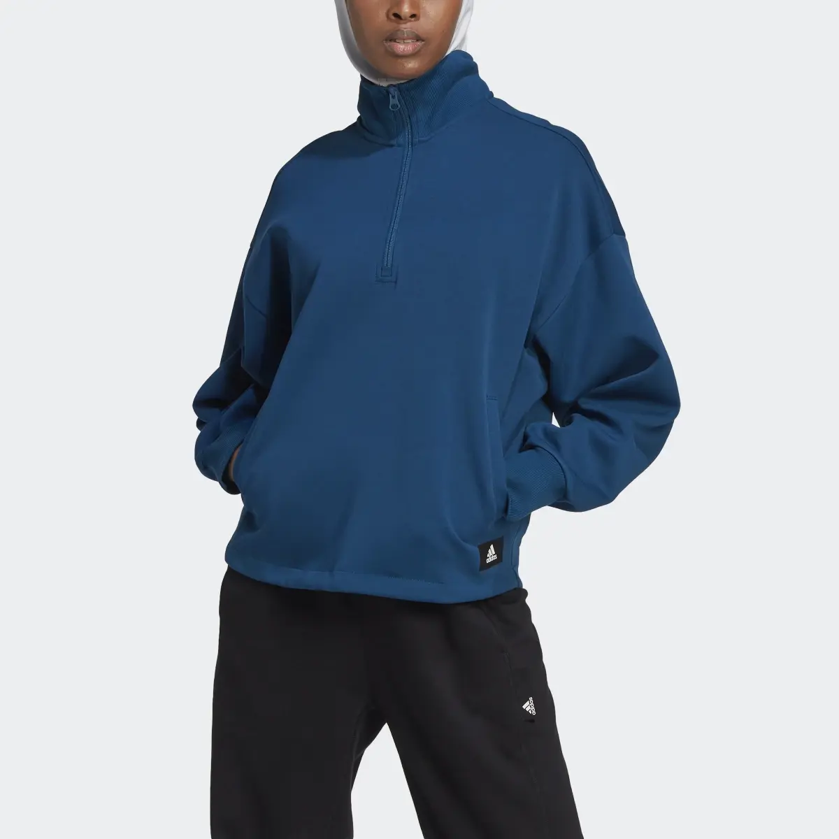 Adidas Future Icons Badge of Sport Quarter-Zip Sweatshirt. 1