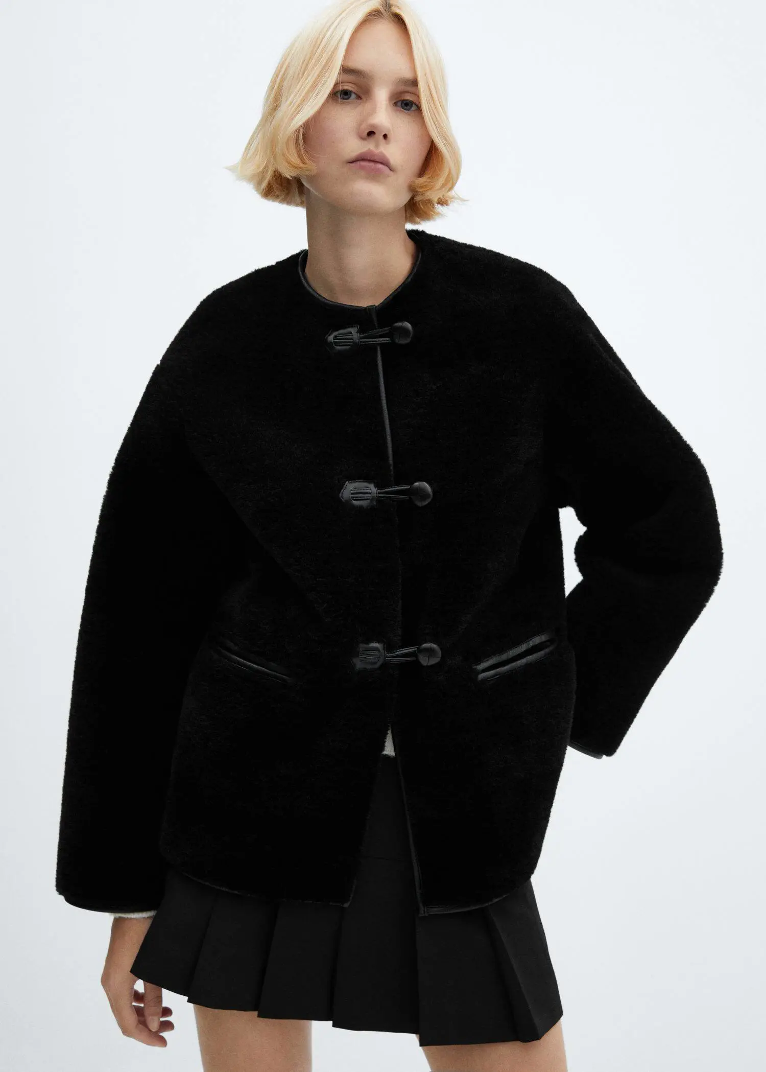 Mango Fur-effect coat with appliqués. 1