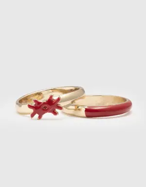 two rings with coral red enamelled details