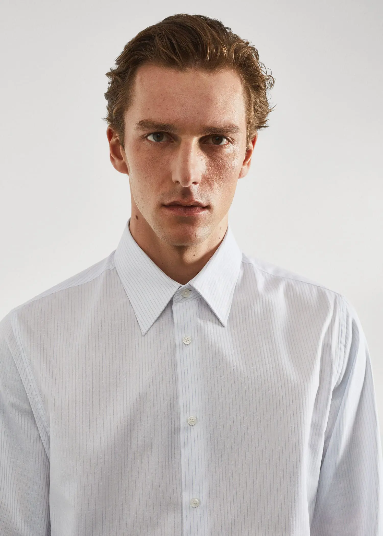 Mango Slim-fit striped cotton twill suit shirt. a young man wearing a white dress shirt. 