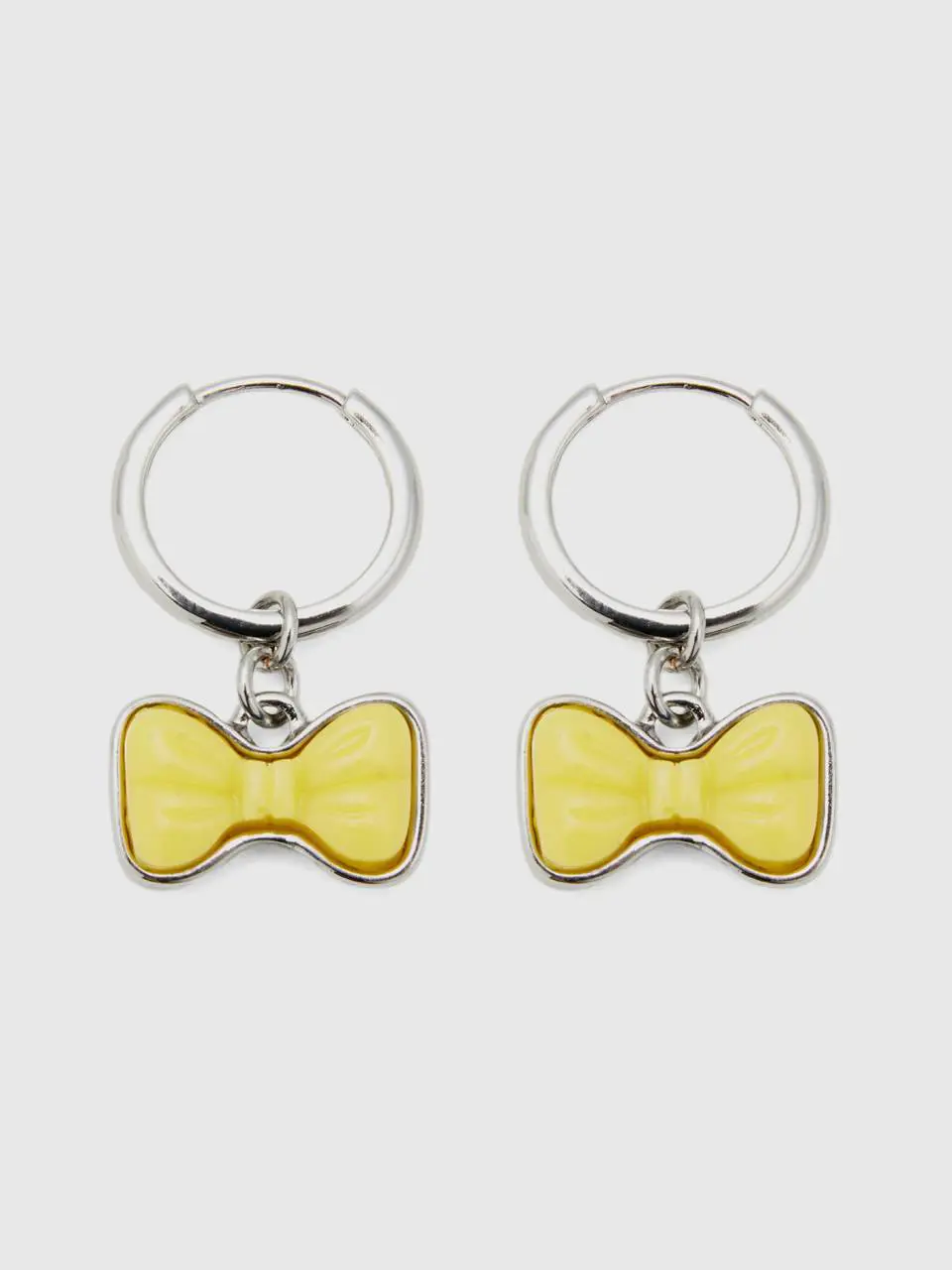 Benetton hoop earrings with yellow bow. 1