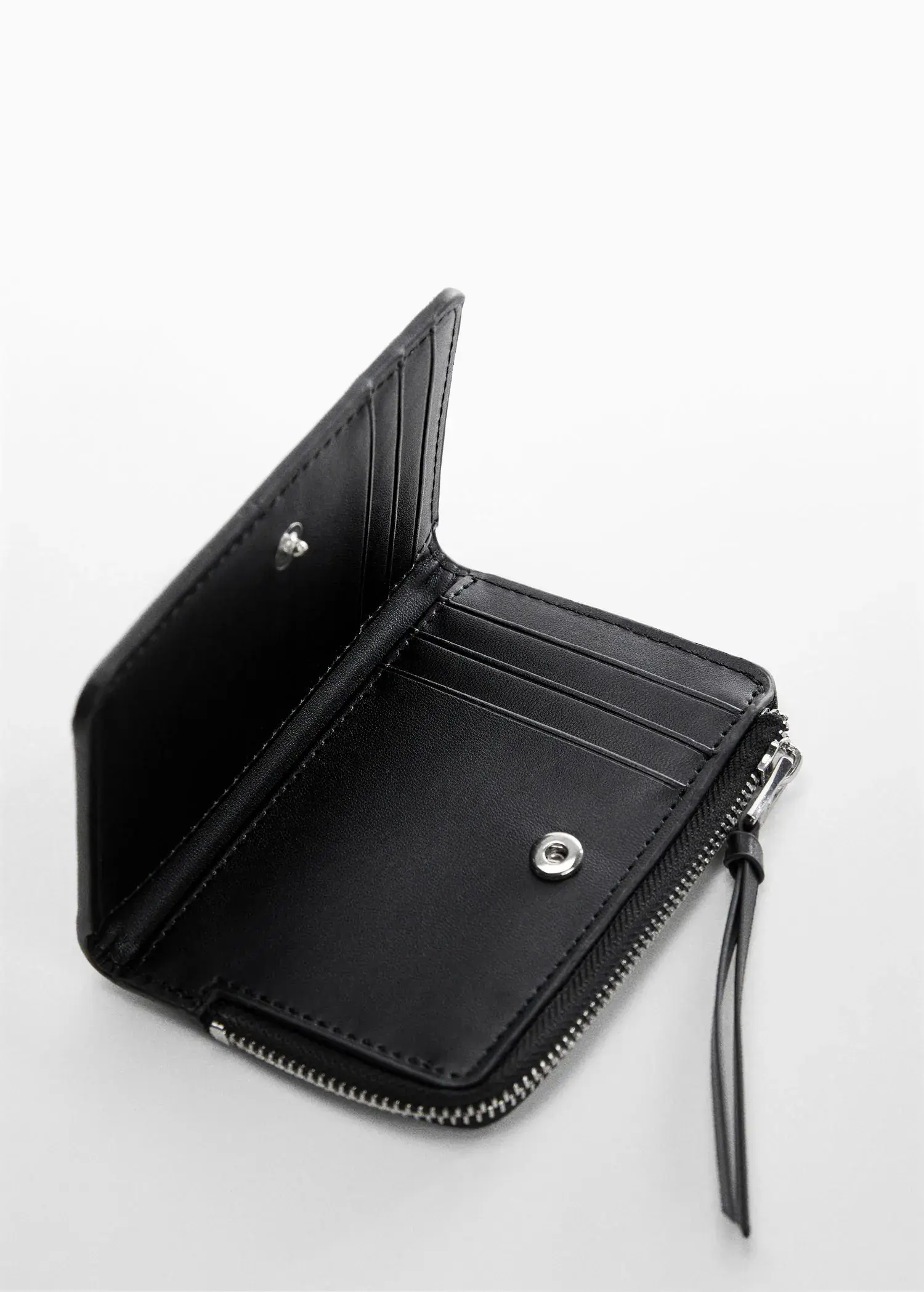Mango Saffiano-effect wallet. an open black wallet sitting on top of a white table. 