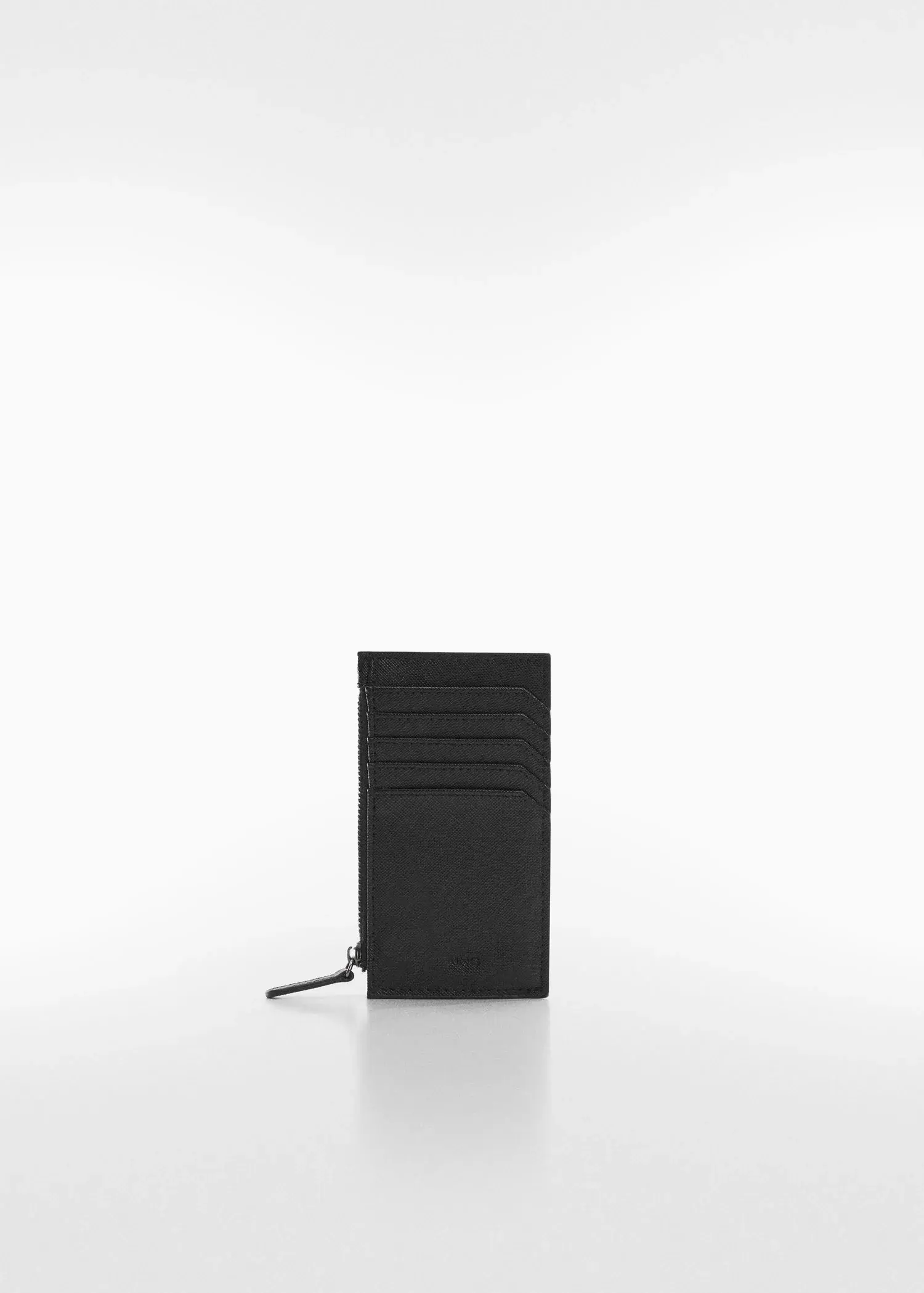 Mango Anti-contactless leather-effect card holder. a black card holder sitting on top of a white table. 