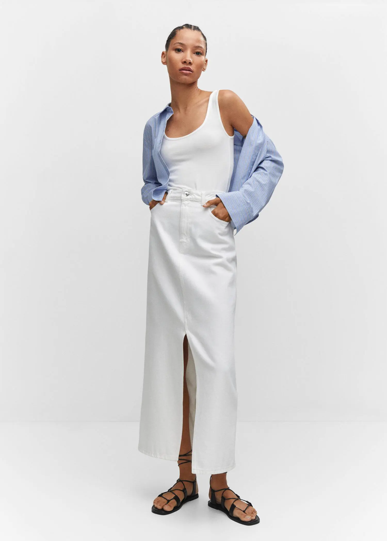 Mango Strapless halter neck top. a woman wearing a white dress and a blue jacket. 