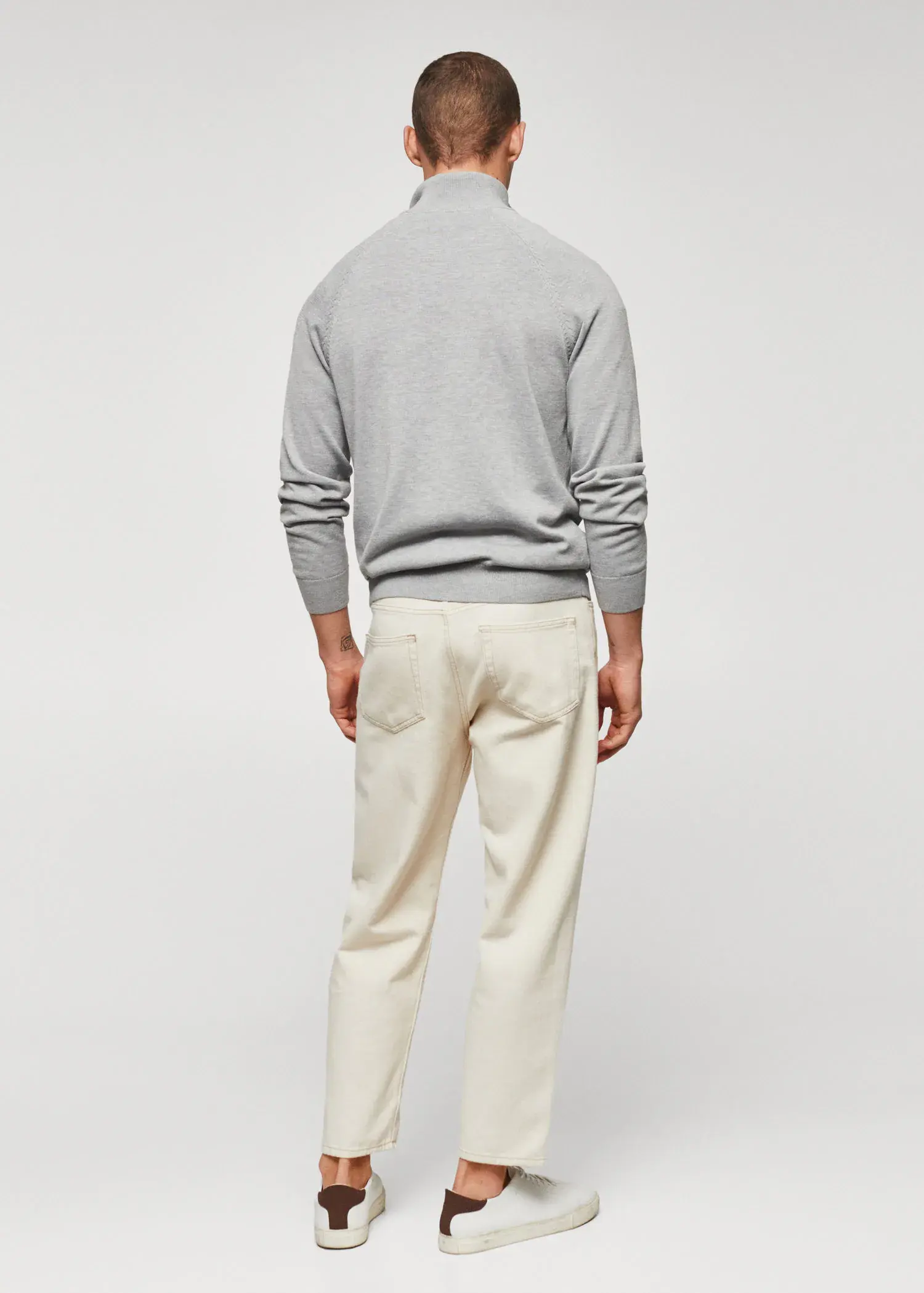 Mango Zipped cotton cardigan. a man wearing a gray sweater and white pants. 