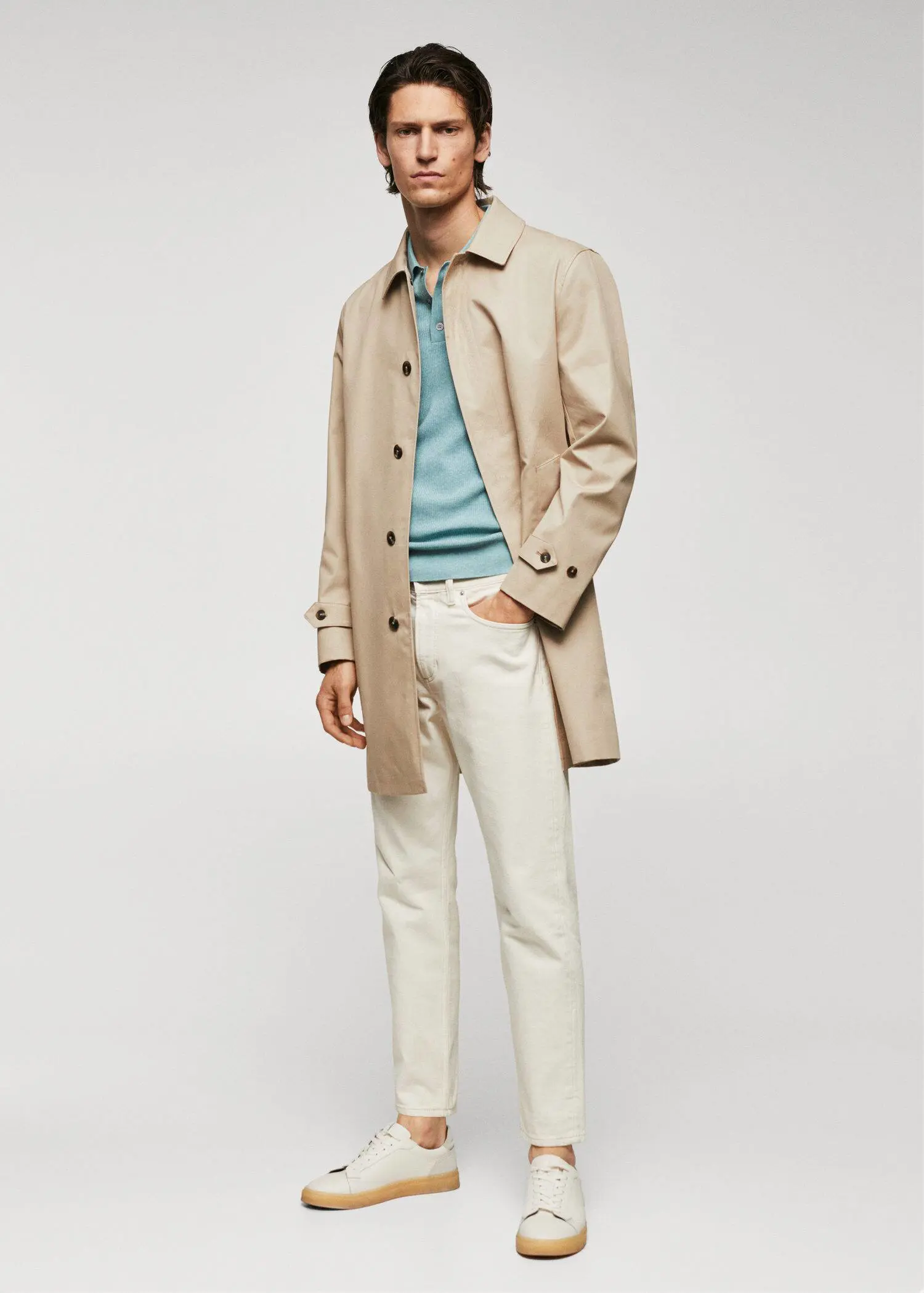 Mango Water-repellent cotton trench coat. a man in a tan coat and white pants. 