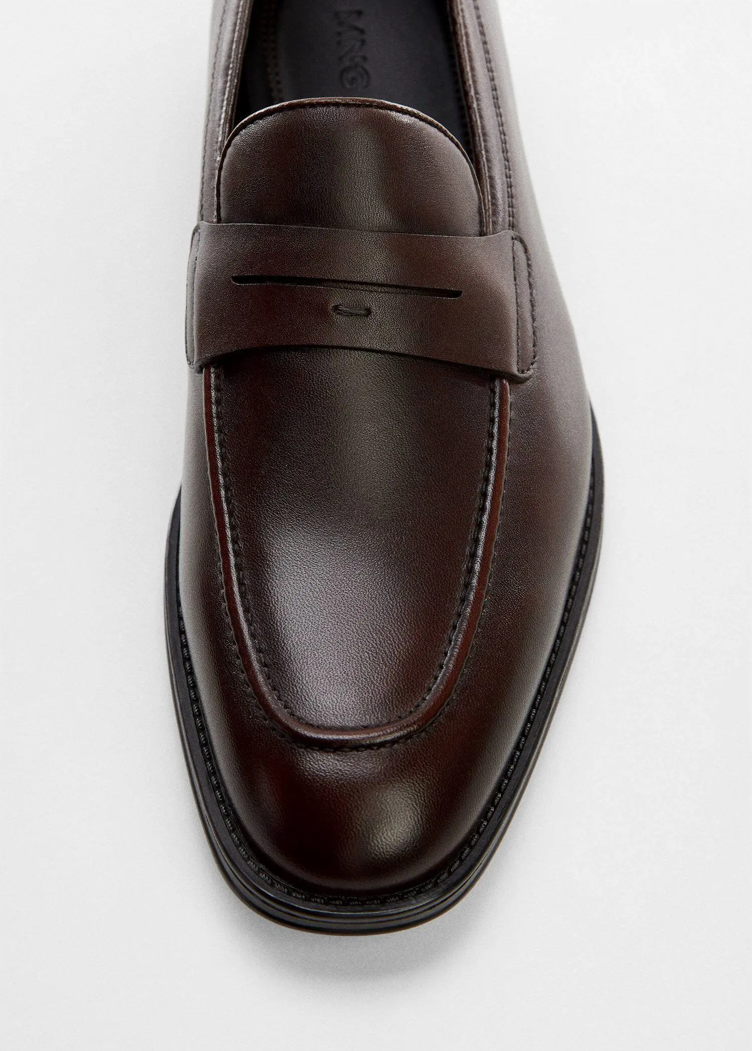 Mango Aged-leather loafers. a close-up of a brown leather shoe. 