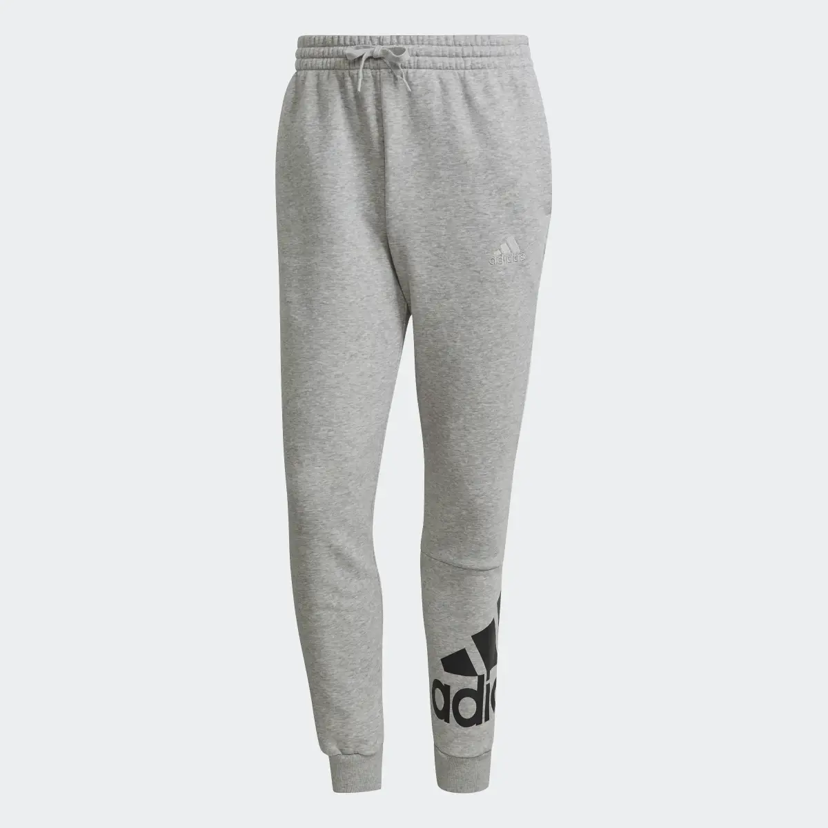 Adidas Essentials Fleece Tapered Cuff Logo Pants. 1