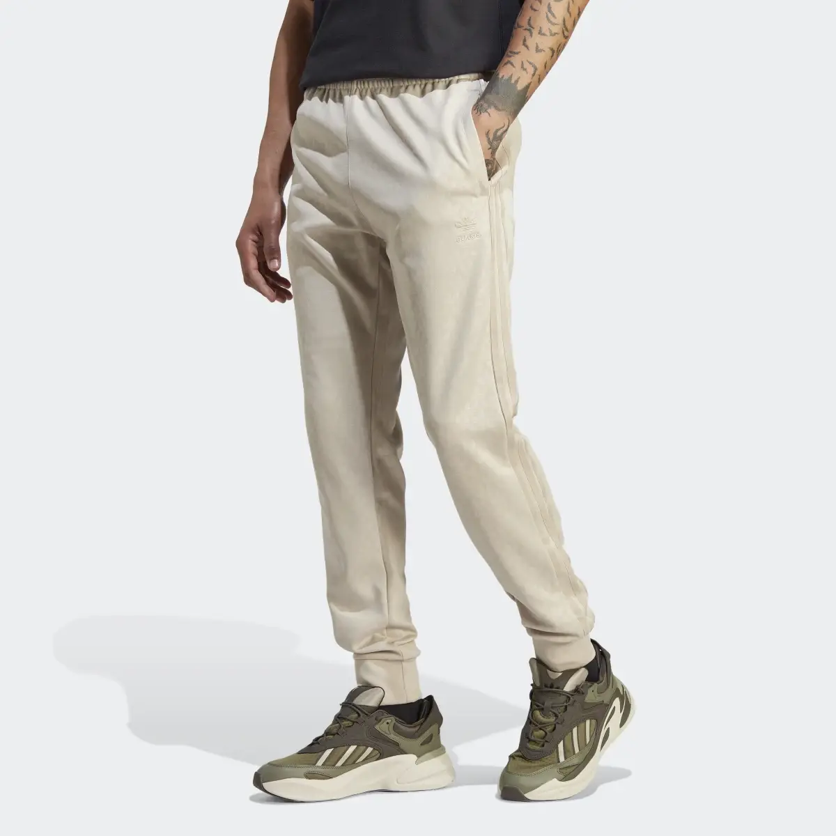 Adidas Graphics Monogram SST Track Joggers. 1