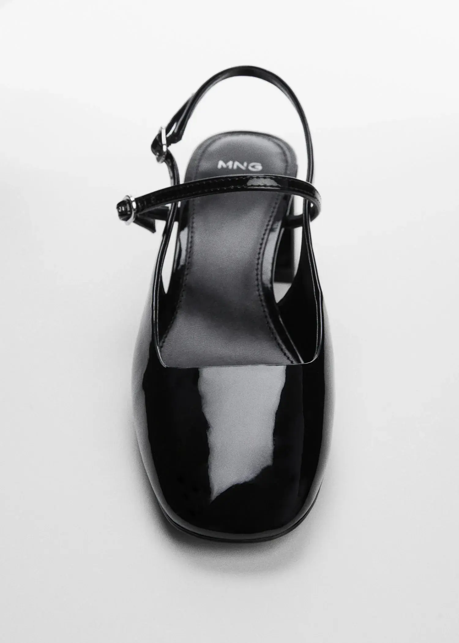 Mango Block heel shoe. a pair of black shoes on a white surface. 