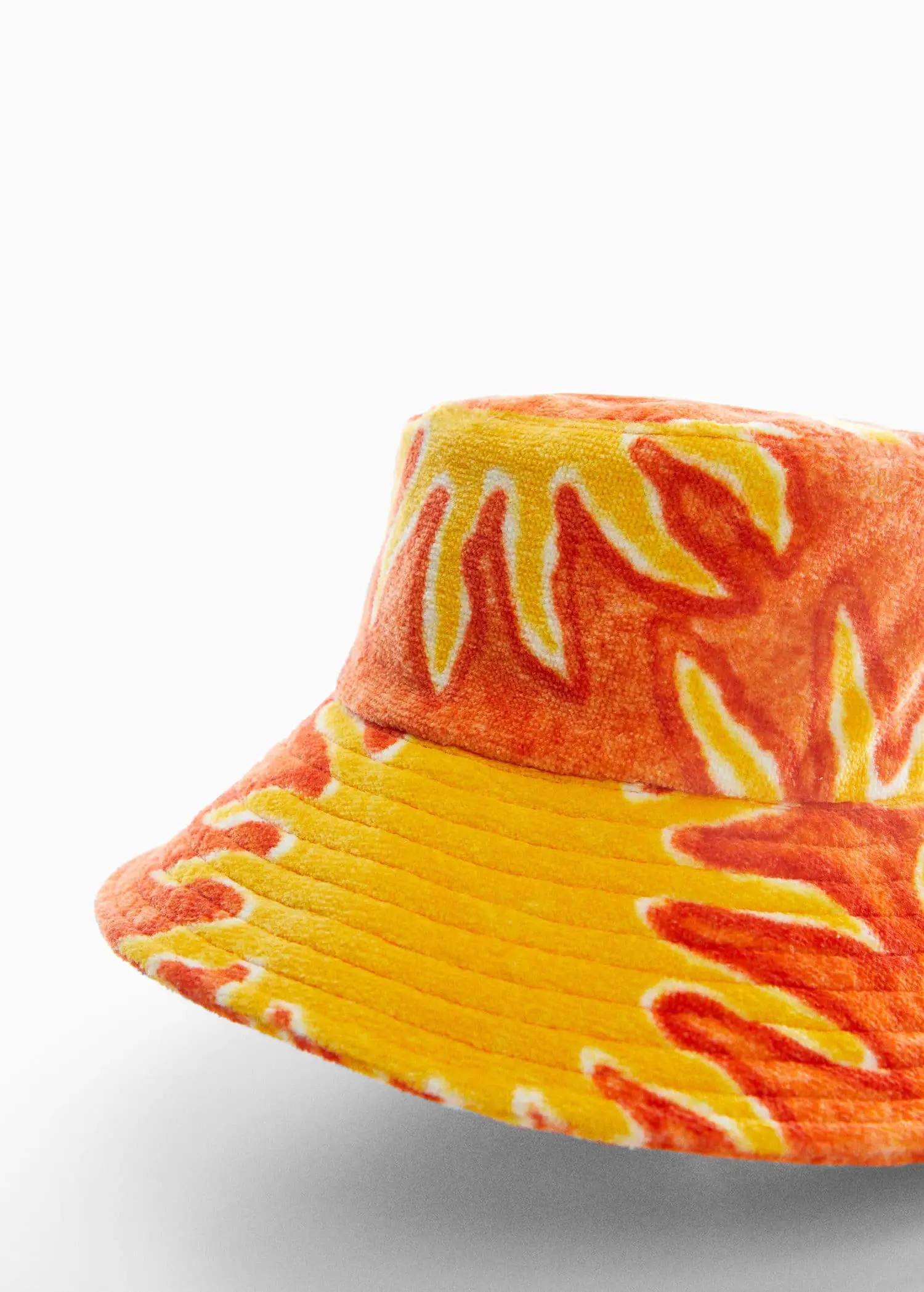 Mango Printed terry cloth bucket hat. a close-up view of a yellow and orange hat. 