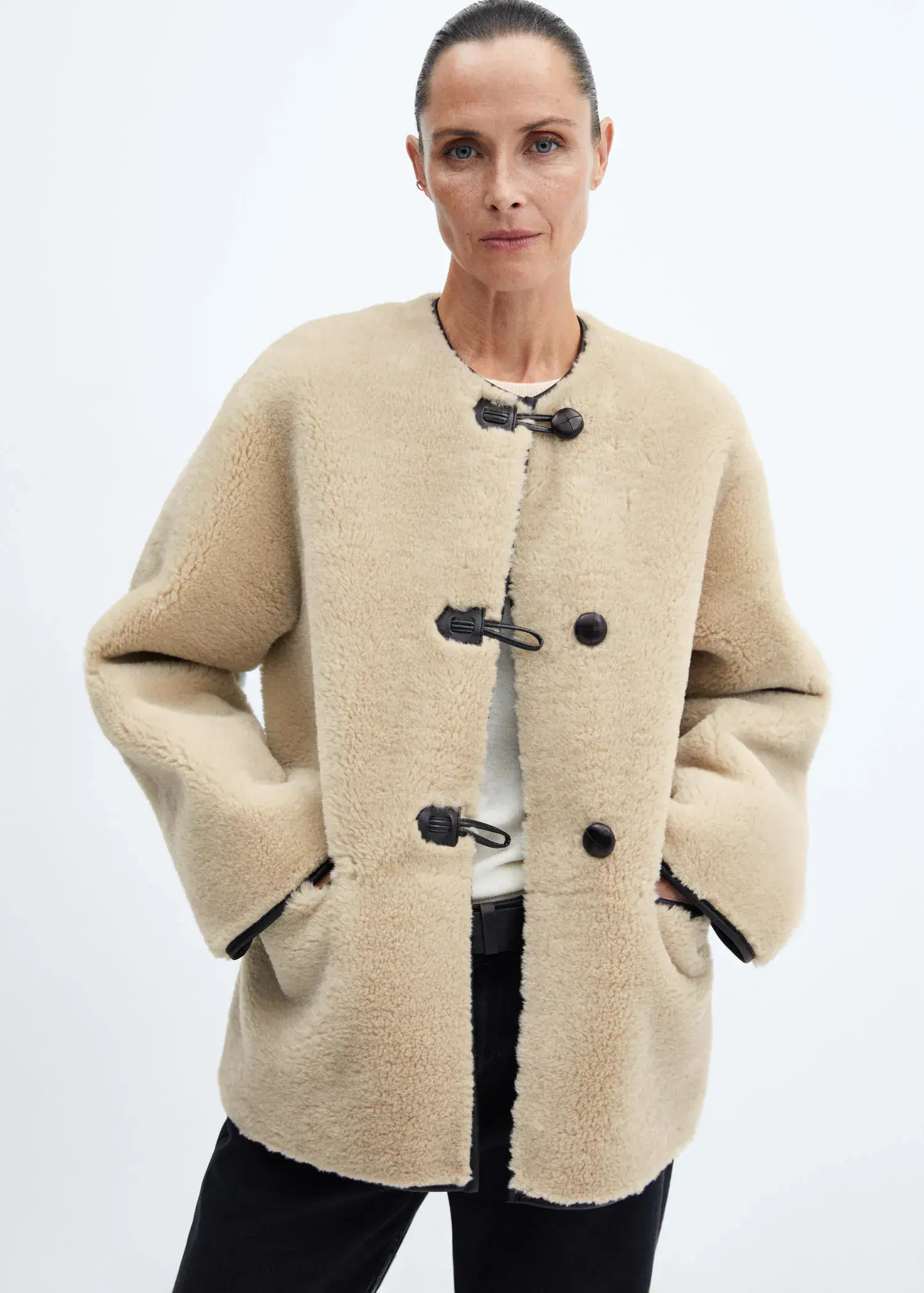 Mango Fur-effect coat with appliqués. 2