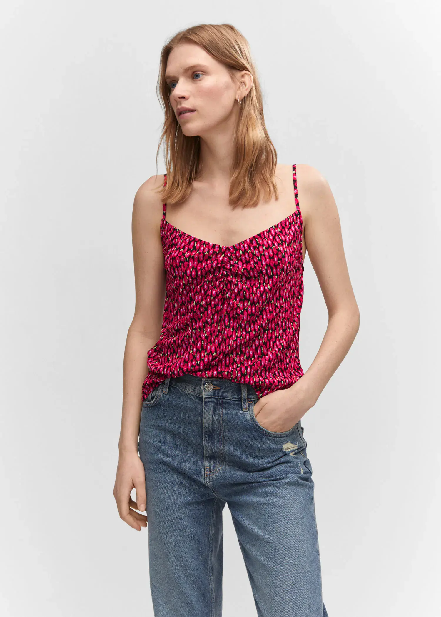 Mango Print ruched top. a woman wearing a red and black patterned tank top. 