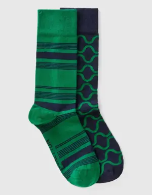 two pairs of dark blue and green socks
