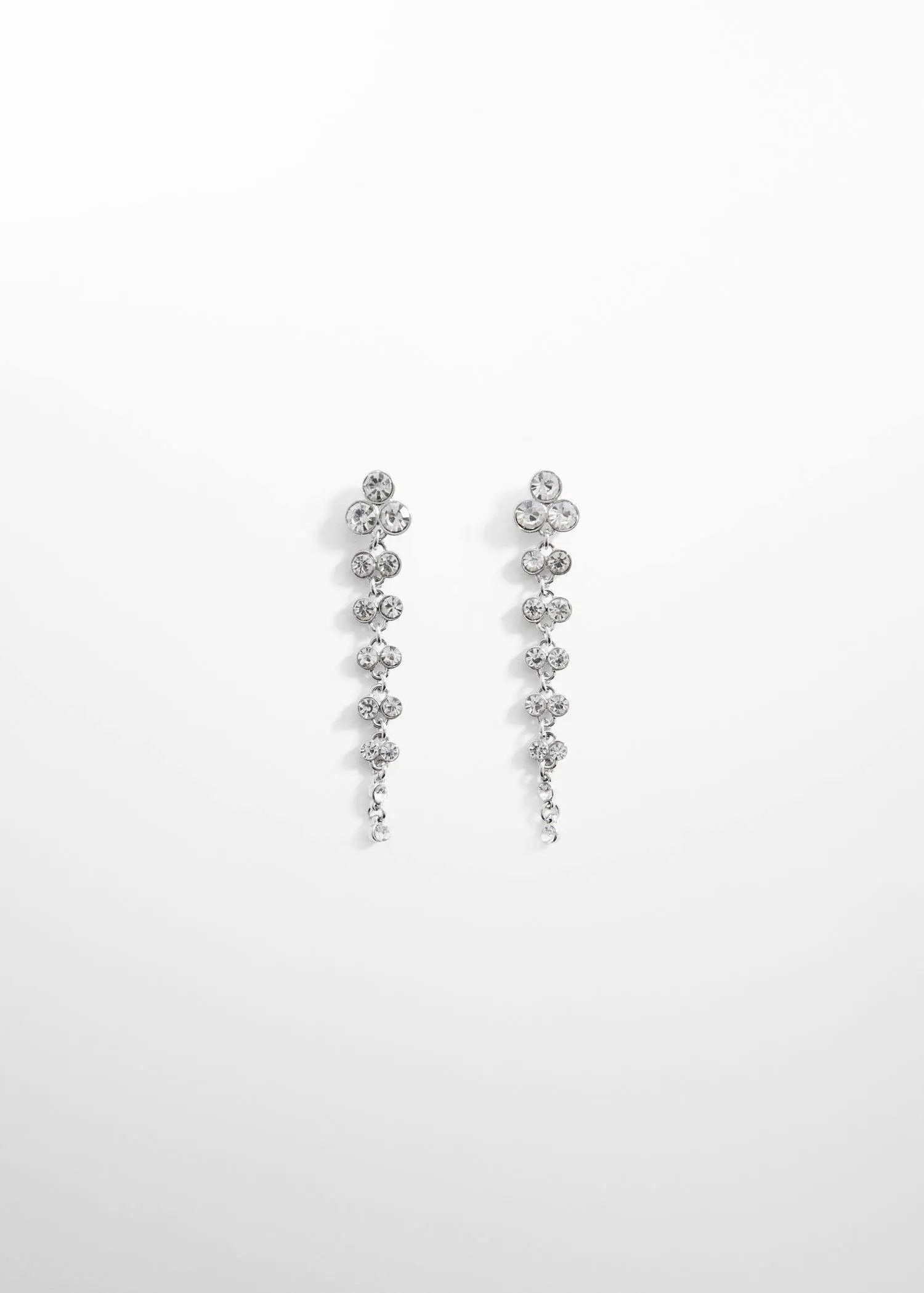 Mango Long rhinestone earrings. a pair of long earrings with diamonds on a white surface. 