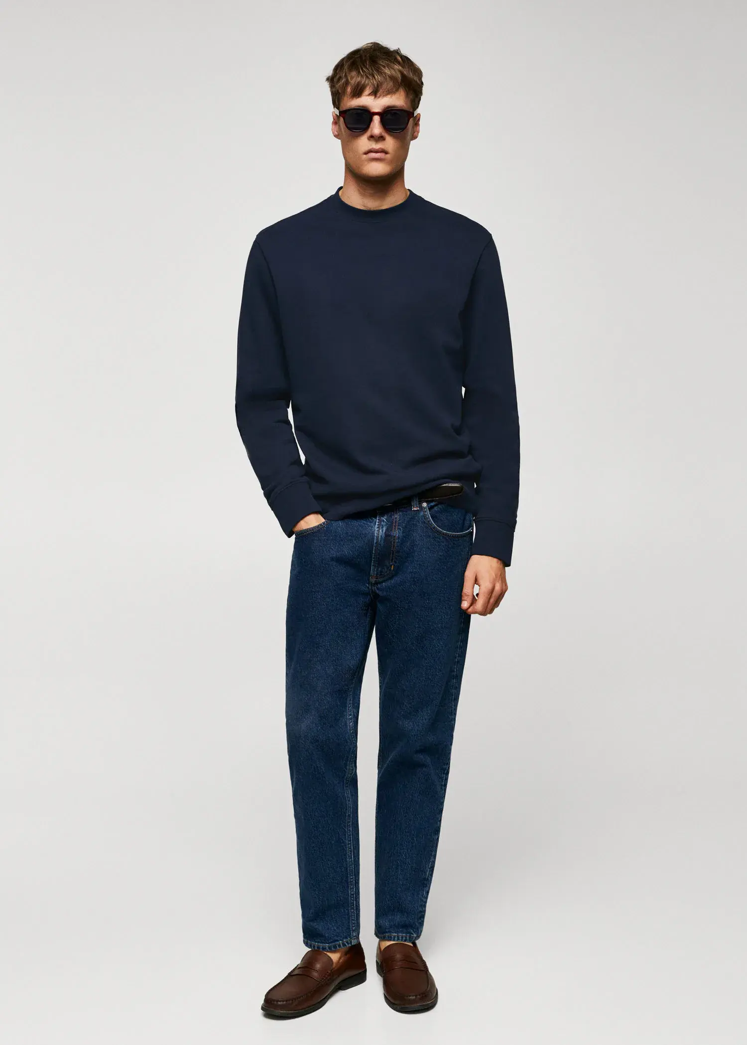 Mango 100% cotton basic sweatshirt . a man in a black sweater and blue jeans. 