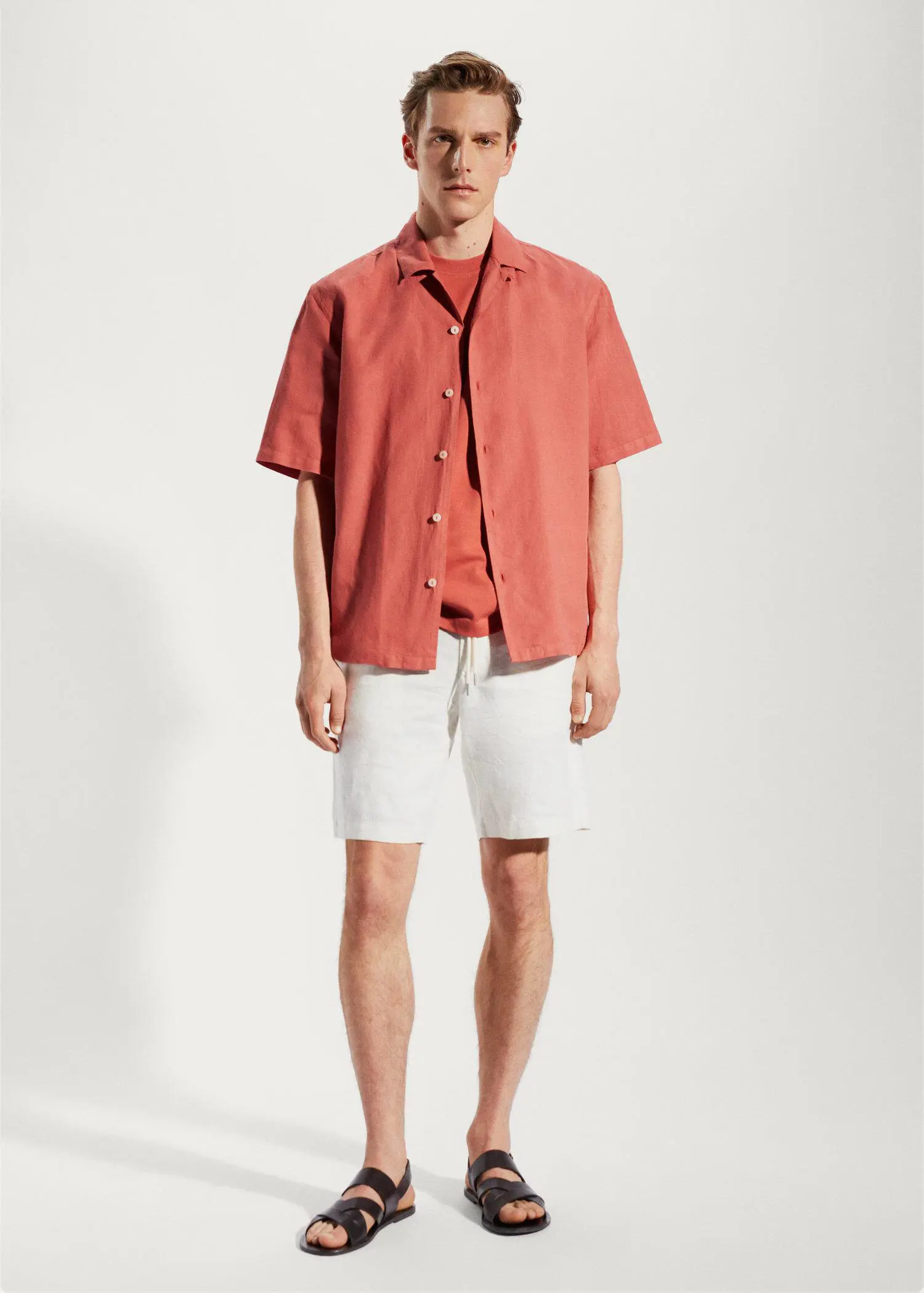 Mango Cotton-linen bowling-collar shirt. a man wearing a red shirt and white shorts. 