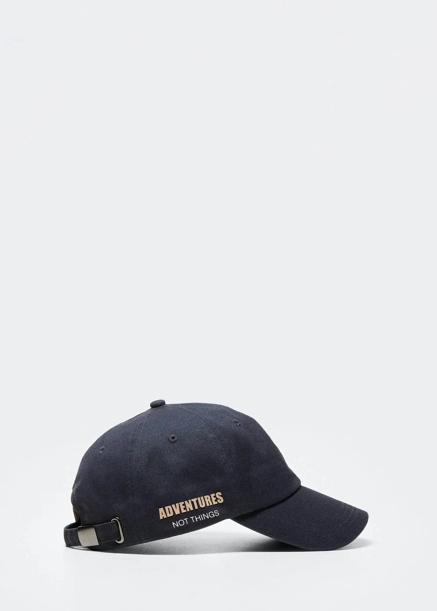 Mango Graphic cotton cap. a hat that is sitting on top of a table. 