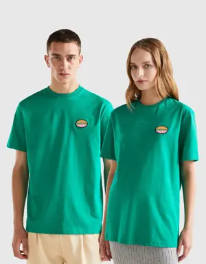 green t-shirt with patch