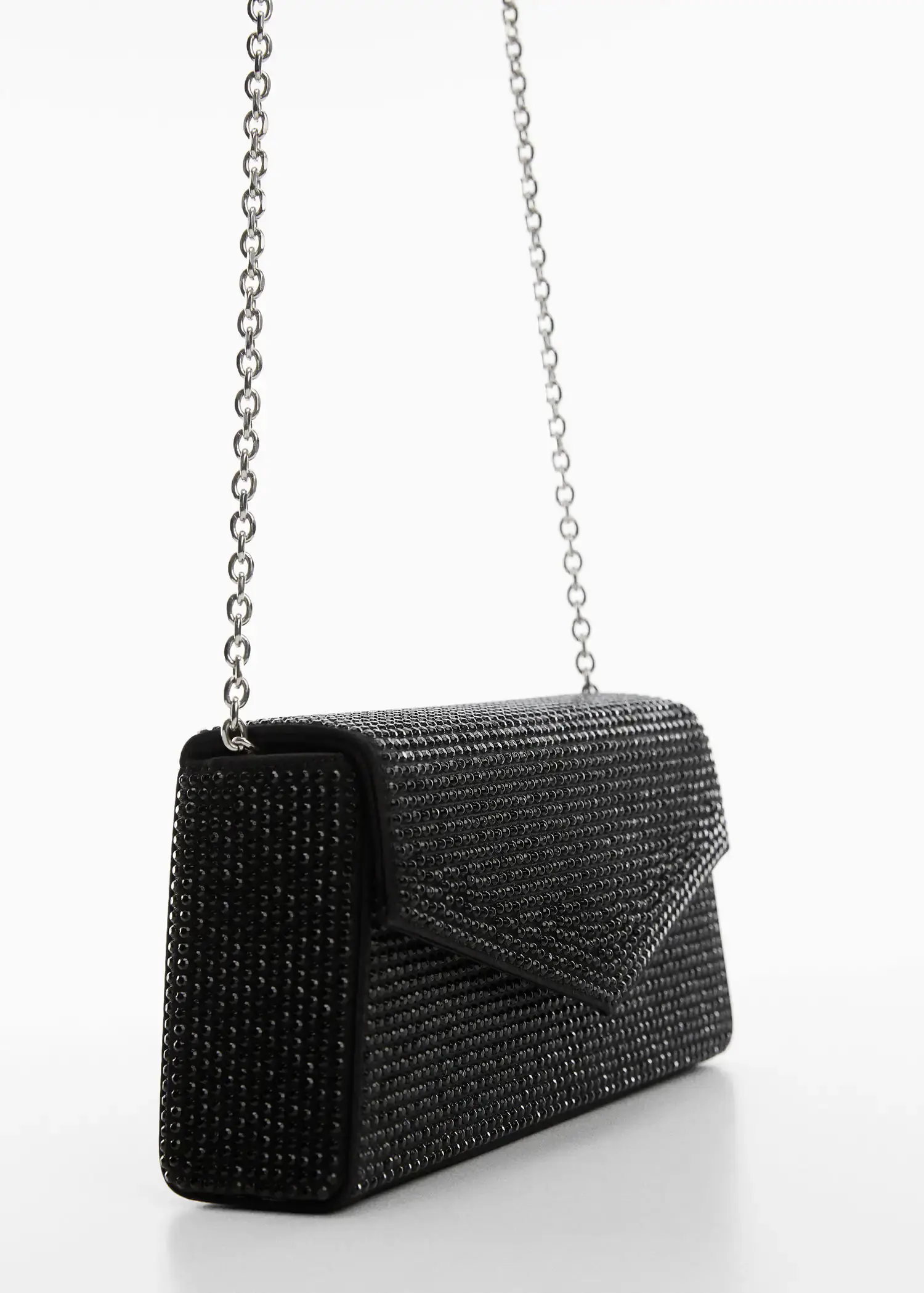 Mango Chain bag with crystals. a close up of a black purse on a white surface 