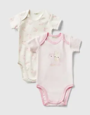 two short sleeve bodysuits in organic cotton