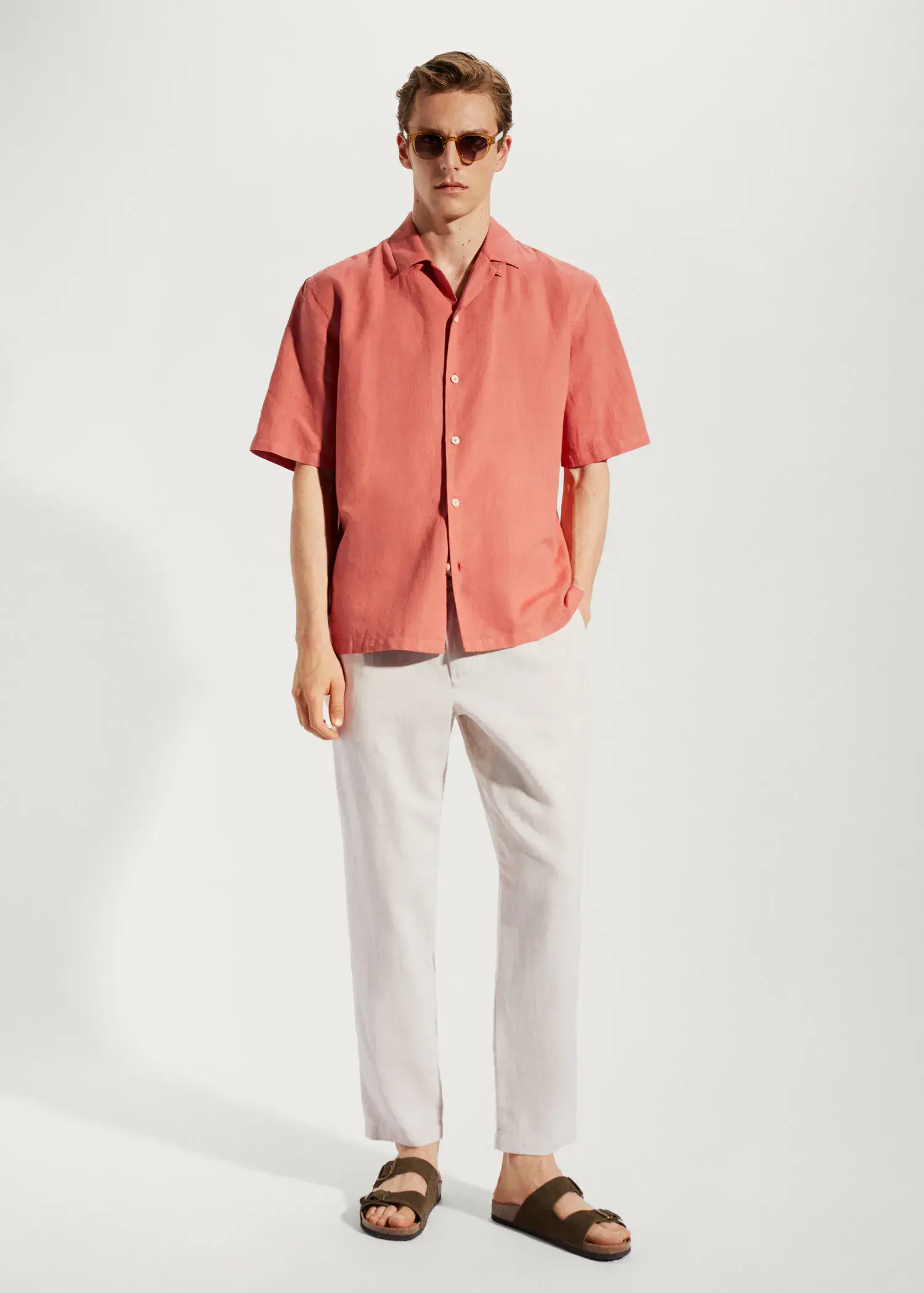 Mango Slim-fit trousers with drawstring . a man wearing a red shirt and white pants. 