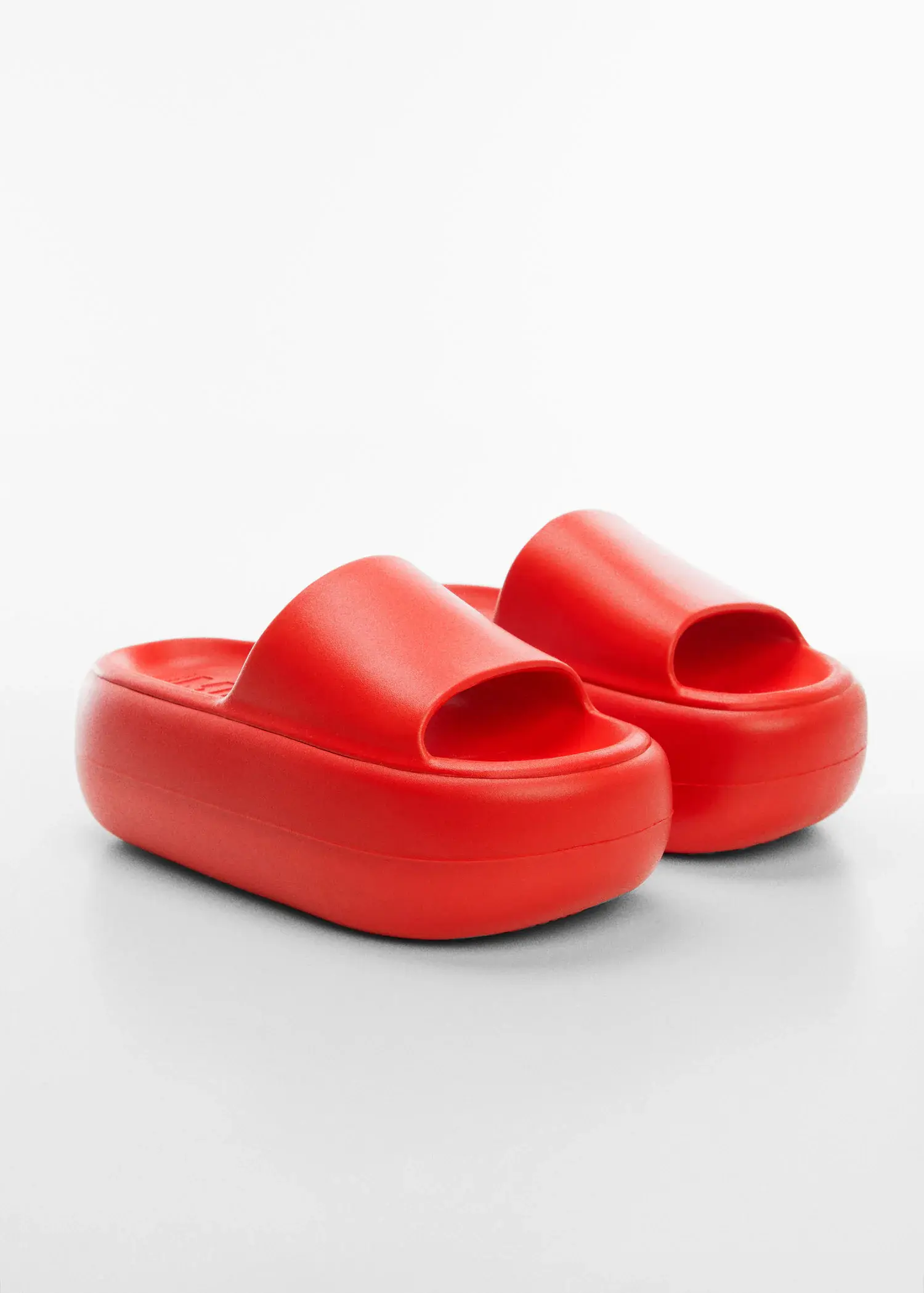 Mango Maxi platform sandals. a pair of red sandals on a white surface. 
