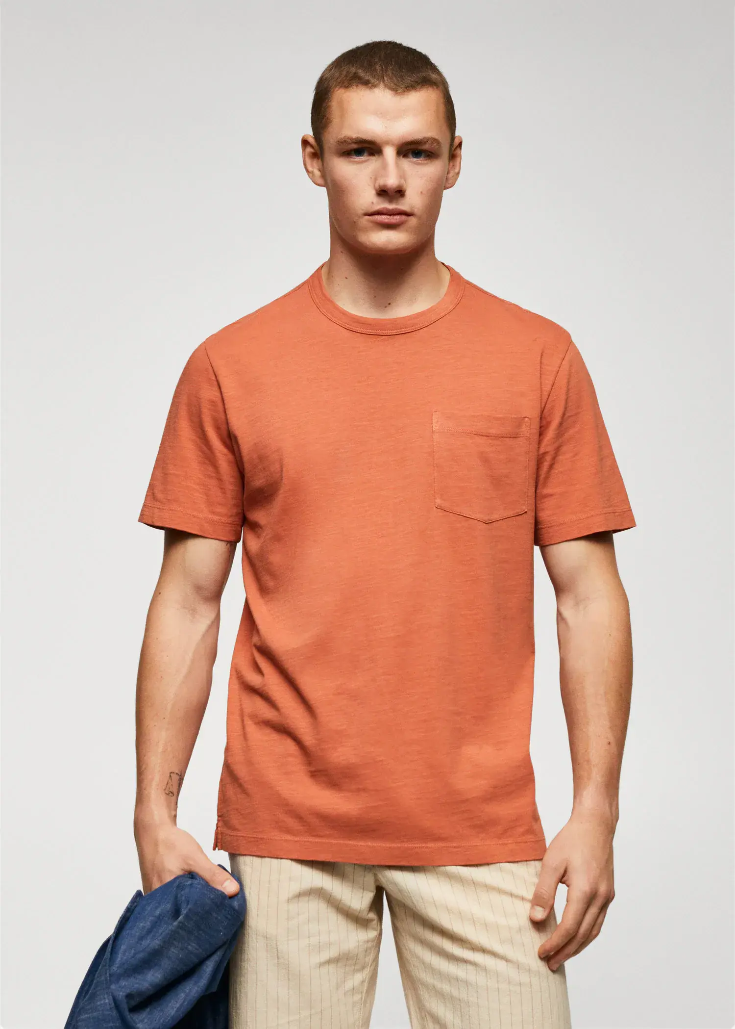 Mango 100% cotton t-shirt with pocket. a man wearing a t-shirt with a pocket. 