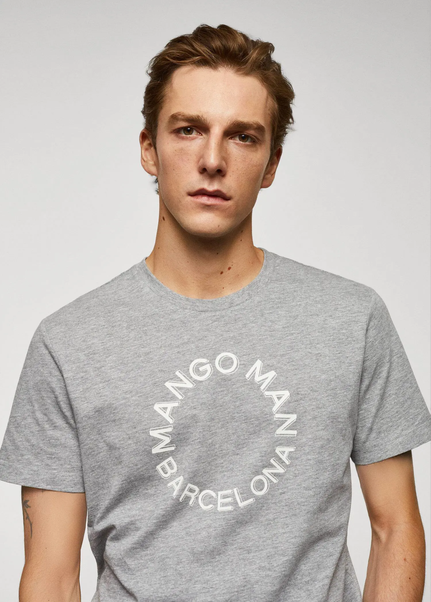 Mango 100% cotton t-shirt with logo. a man wearing a t-shirt that says " mango man barcelona ". 