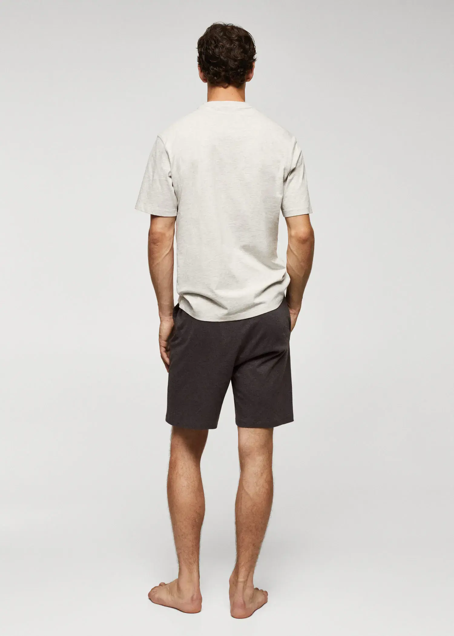 Mango Cotton pajama shorts pack. a man wearing a white shirt and black shorts. 