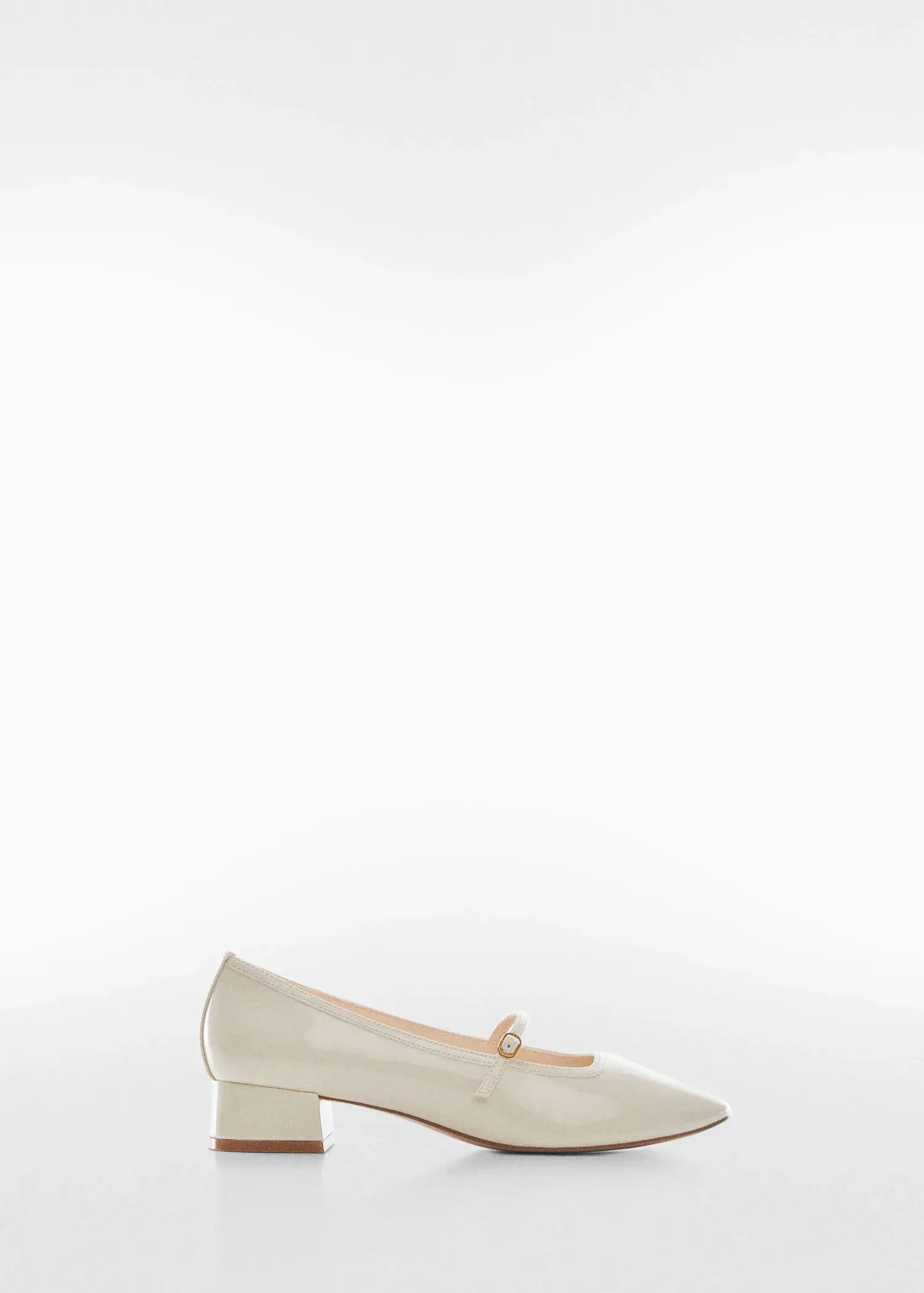 Mango Heeled shoes with buckle. a pair of white shoes on a white background. 