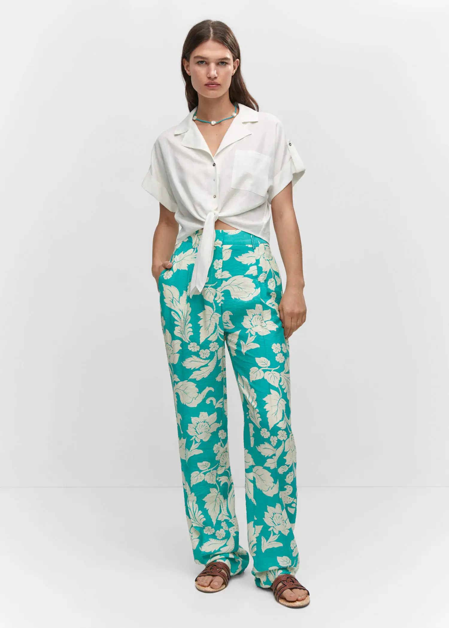 Mango Printed straight trousers. a person standing wearing a white shirt and green pants. 