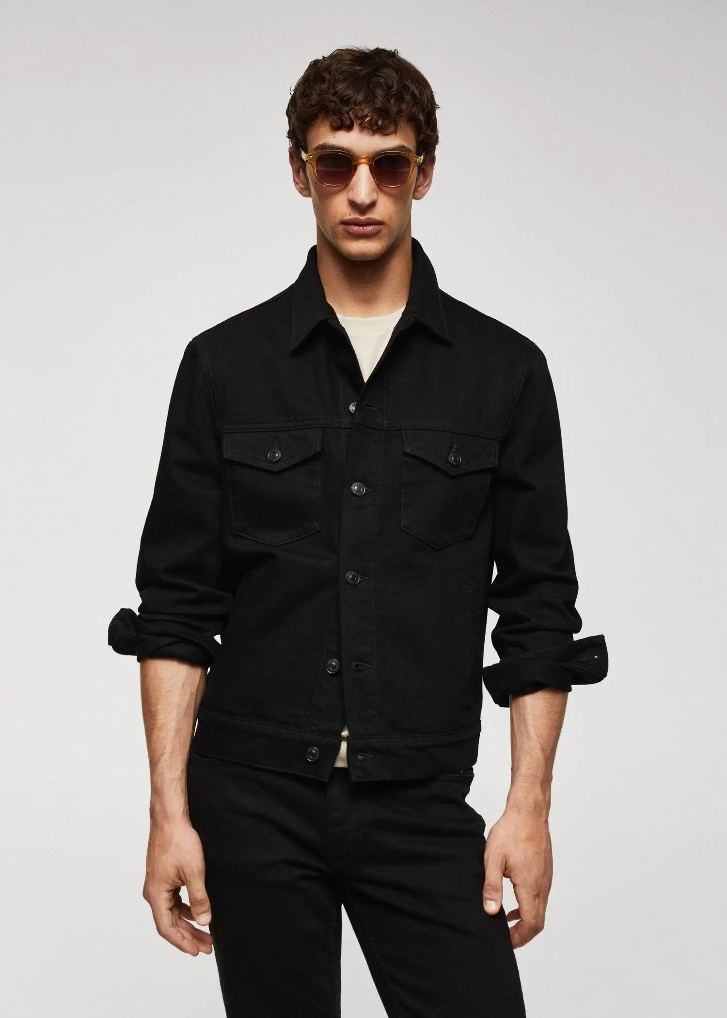 Mango Basic denim jacket. a man wearing a black jacket and sunglasses. 