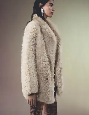 Leather coat with fur-effect interior