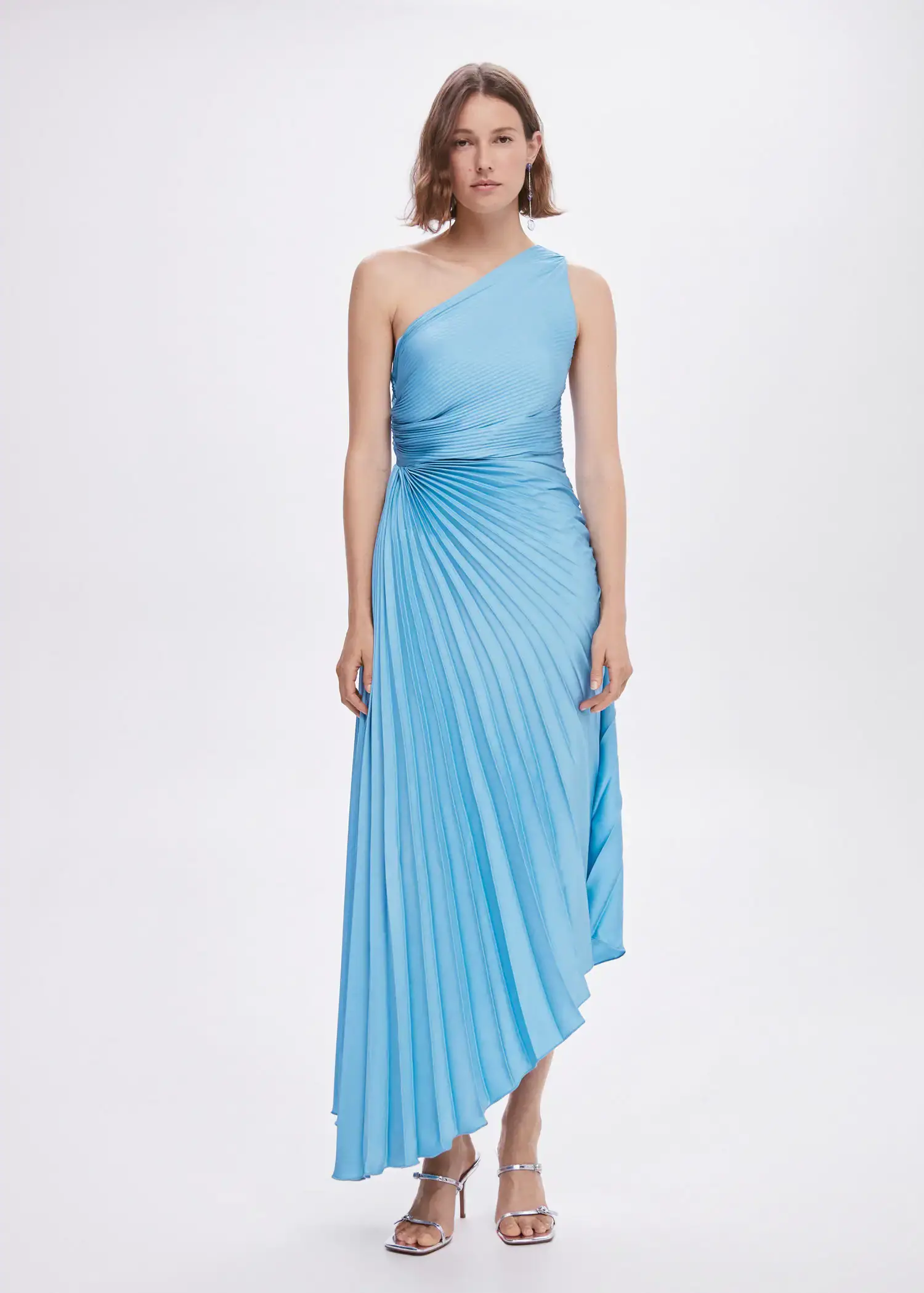 Mango Asymmetrical pleated dress. a woman in a blue dress posing for a picture. 