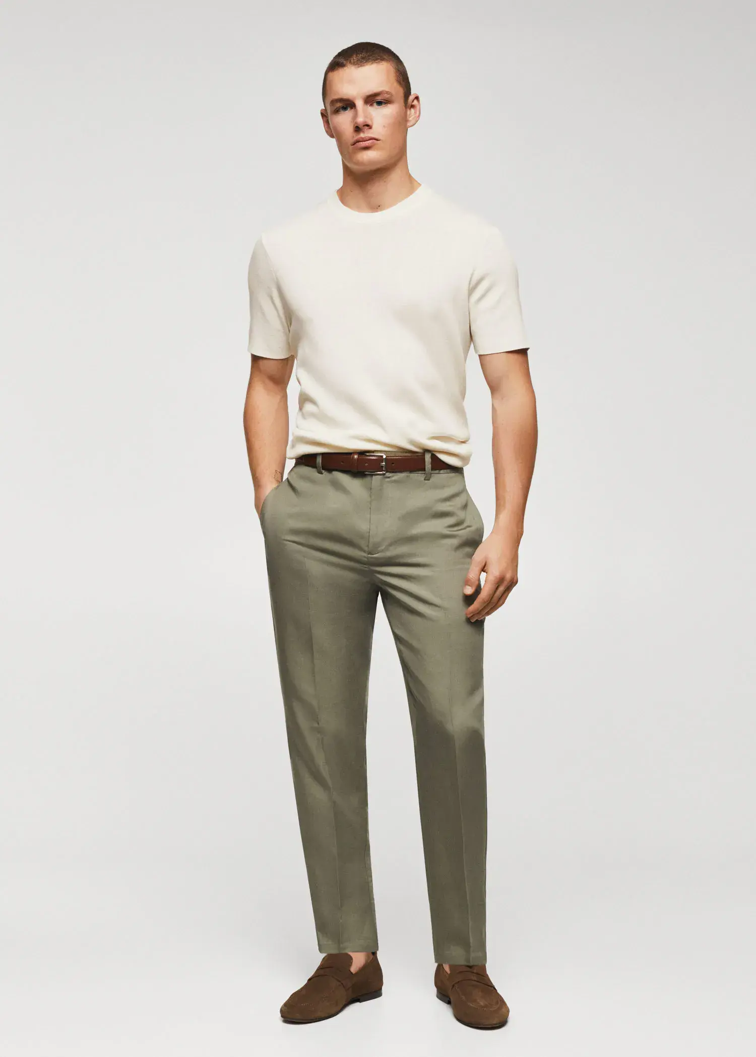 Mango Cotton fine-knit t-shirt. a man in a white shirt and green pants. 