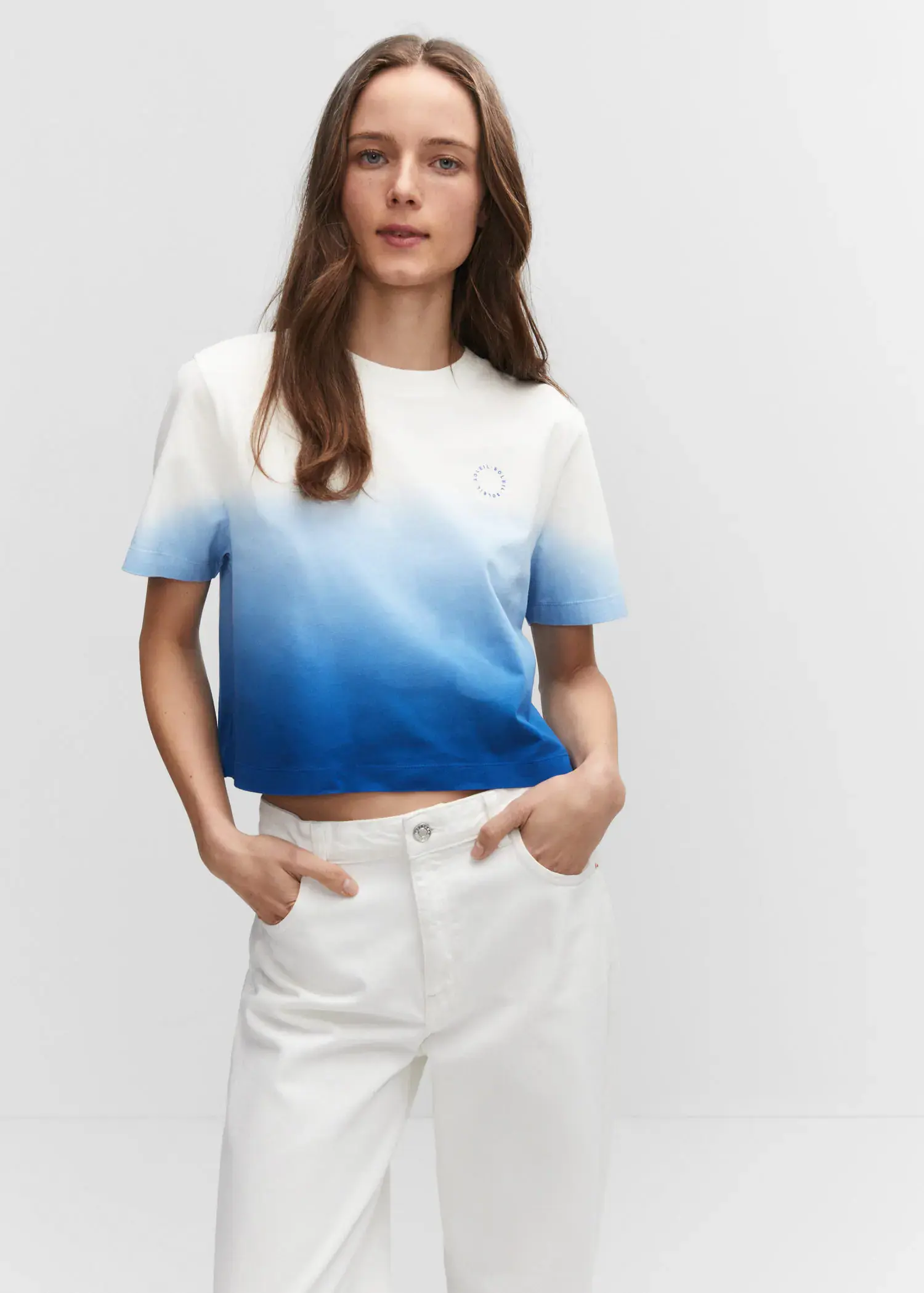 Mango Cotton ombré t-shirt. a woman wearing white pants and a blue and white t shirt. 