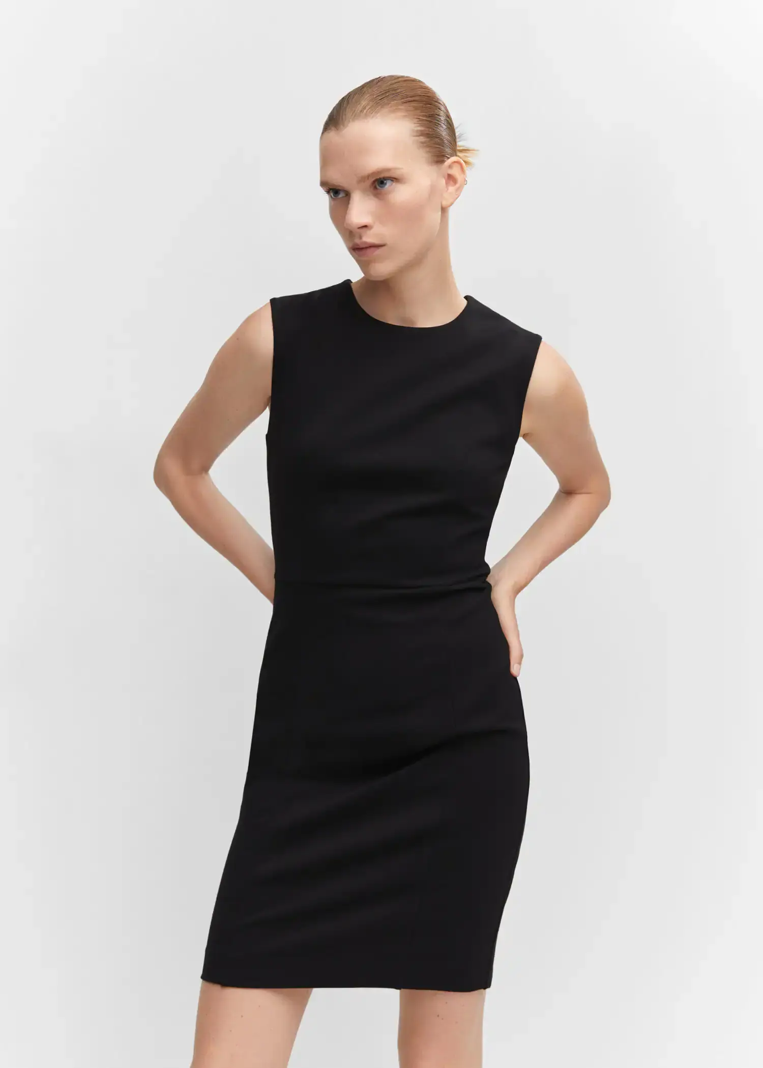 Mango Roma-knit sleeveless dress. a woman in a black dress posing for a picture. 