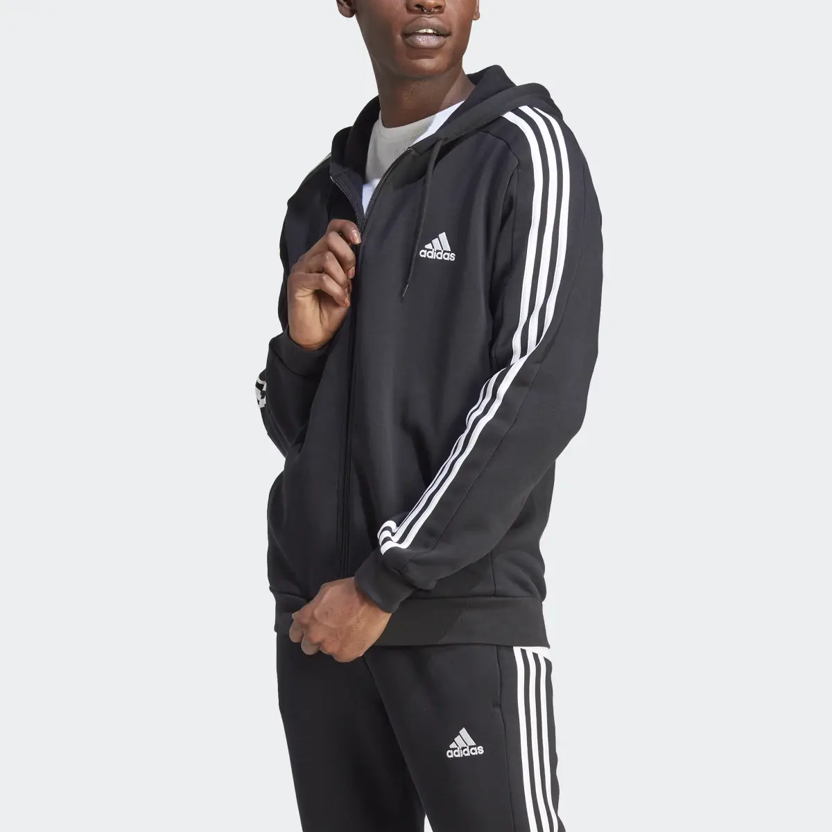 Adidas Felpa con cappuccio Essentials Fleece 3-Stripes Full-Zip. 1