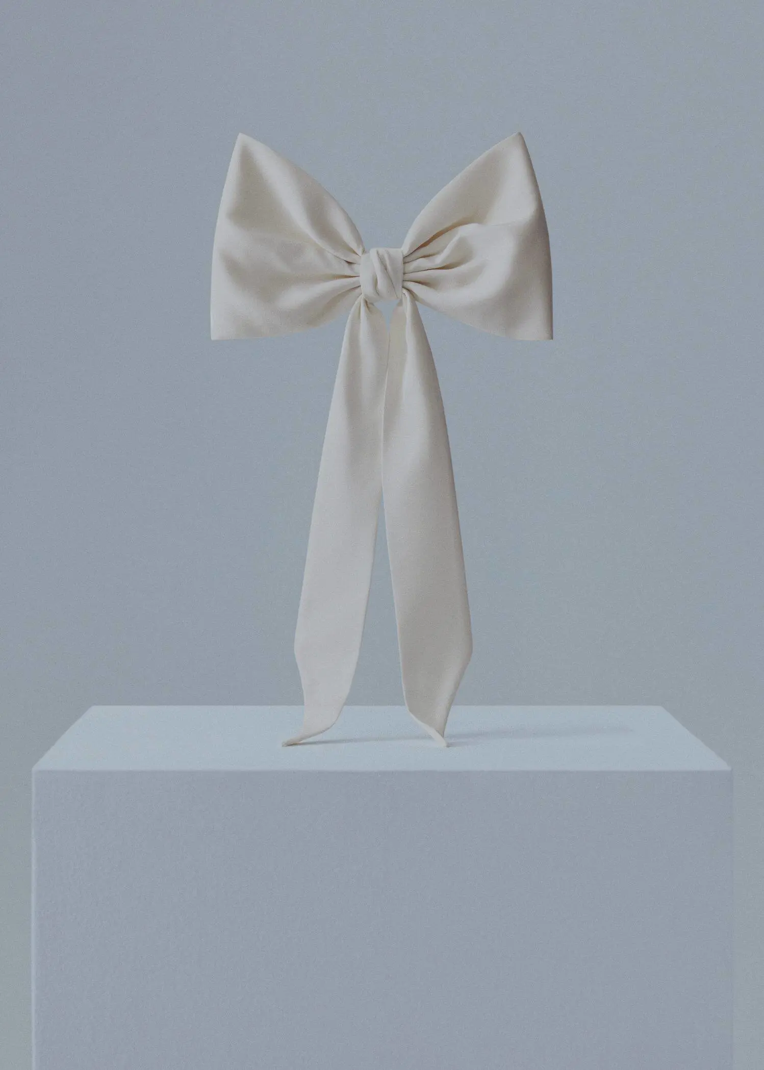 Mango Hair clip with maxi bow. a white bow sitting on top of a white box. 