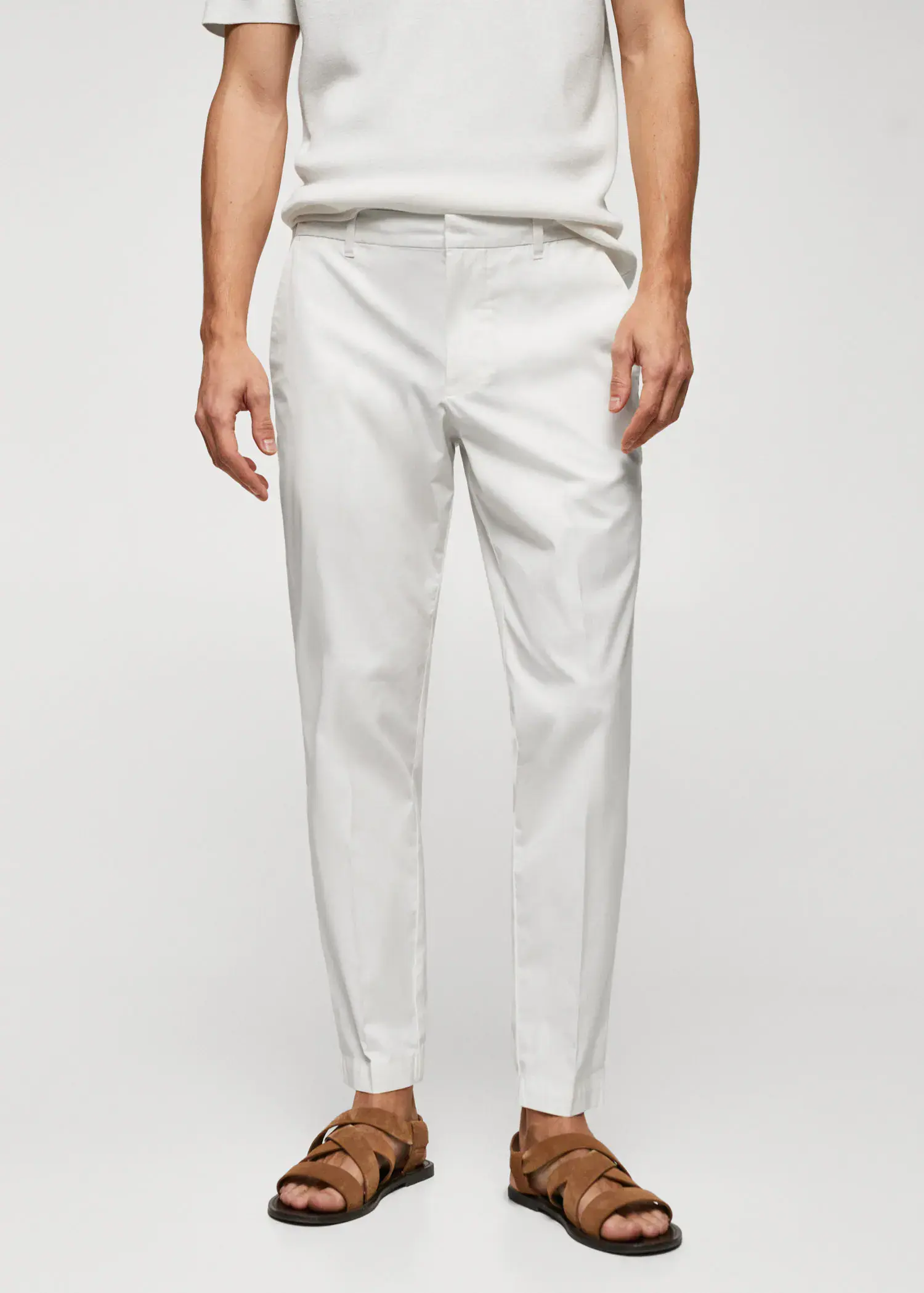 Mango Slim-fit cotton pants. a man wearing white pants and a white shirt. 