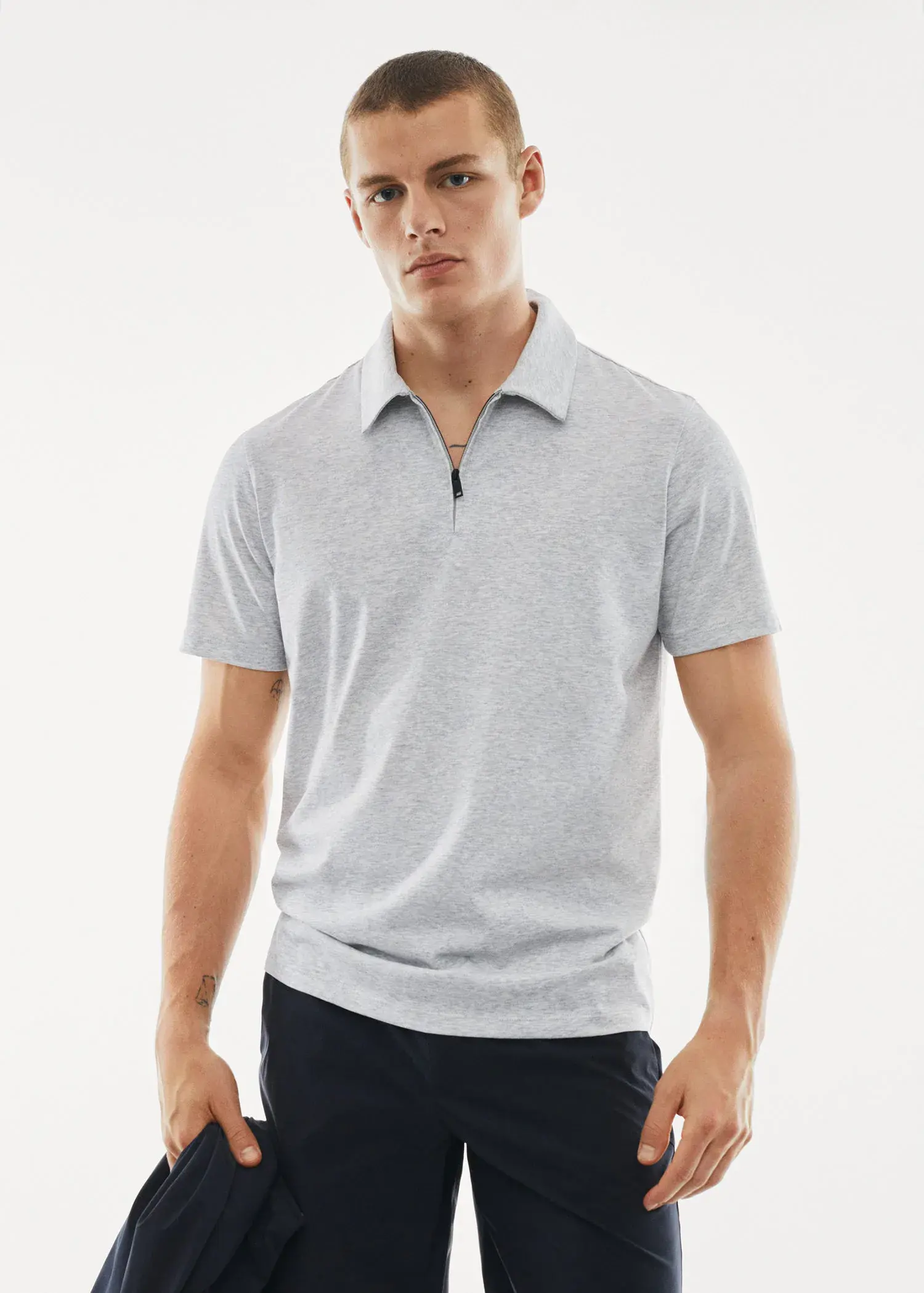 Mango Zip cotton polo shirt. a man in a white shirt is posing for a picture 