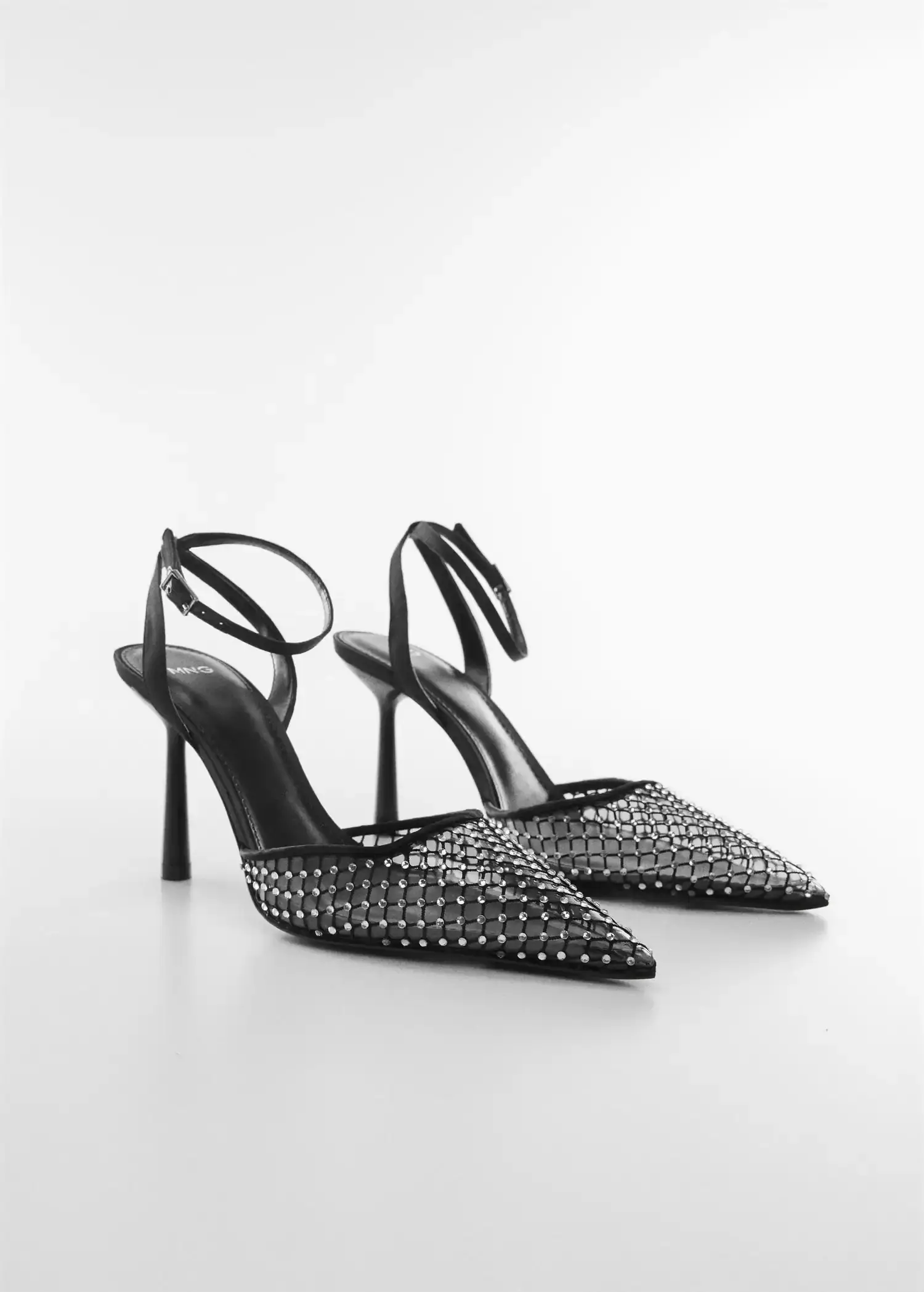 Mango Rhinestone mesh shoe. a pair of black high heel shoes on a white surface. 
