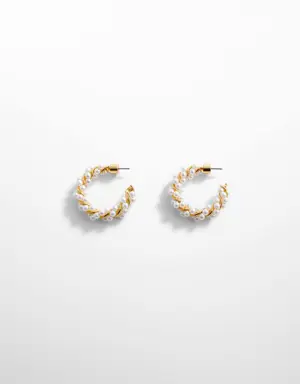 Hoop earrings intertwined with pearls