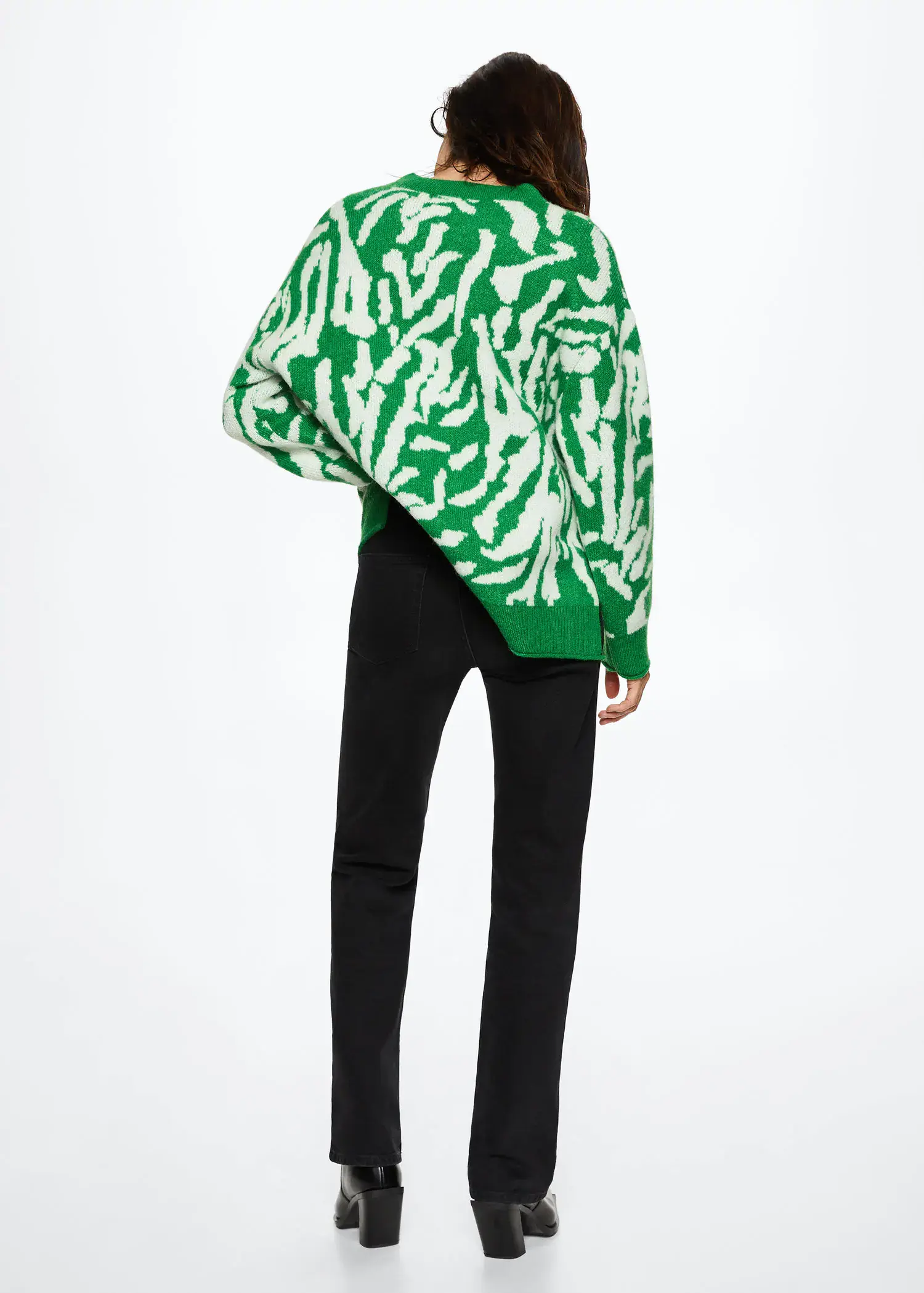 Mango Animal-print knitted sweater. a person wearing a green and white sweater. 