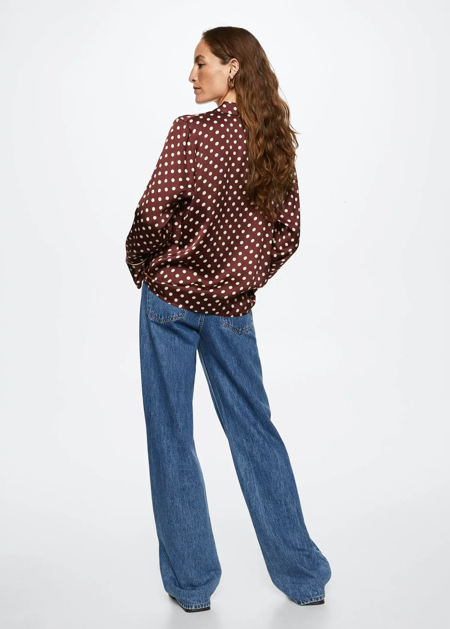 Mango Polka-dot satin-finish shirt. a woman wearing jeans and a polka dot shirt. 