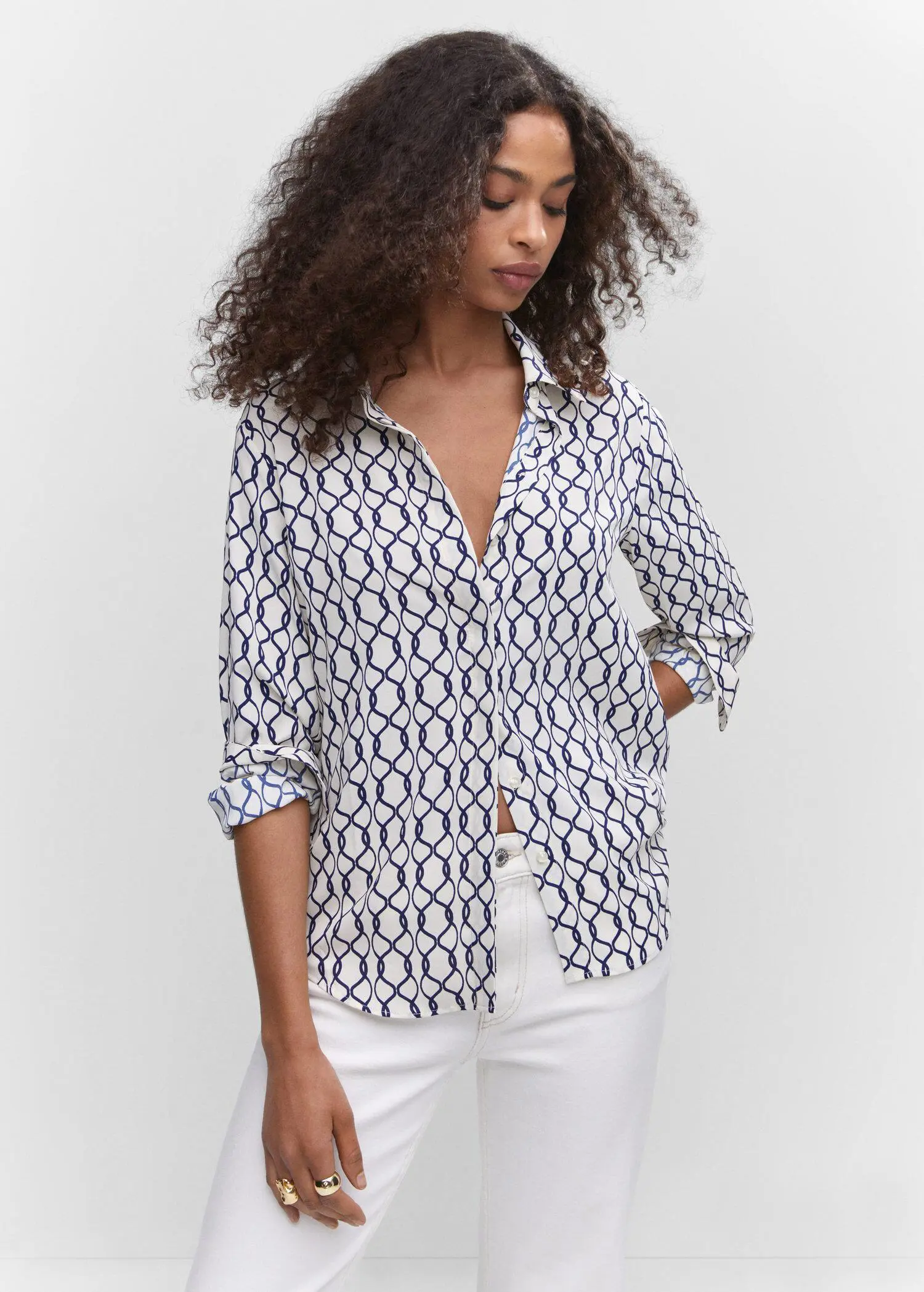 Mango Regular flowy shirt. a woman wearing a white and blue shirt. 