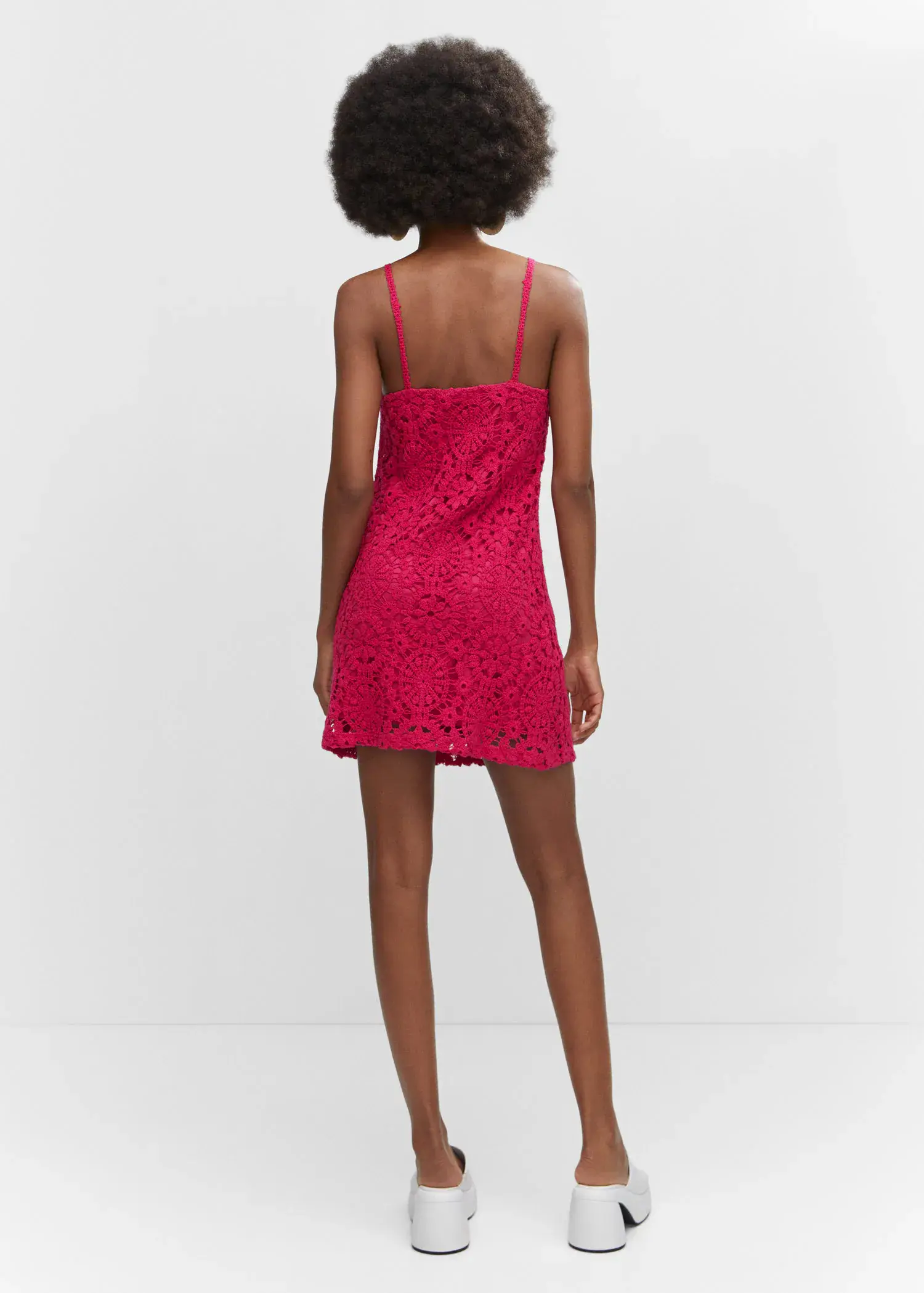 Mango Crochet short dress. a person wearing a red dress standing in front of a wall. 